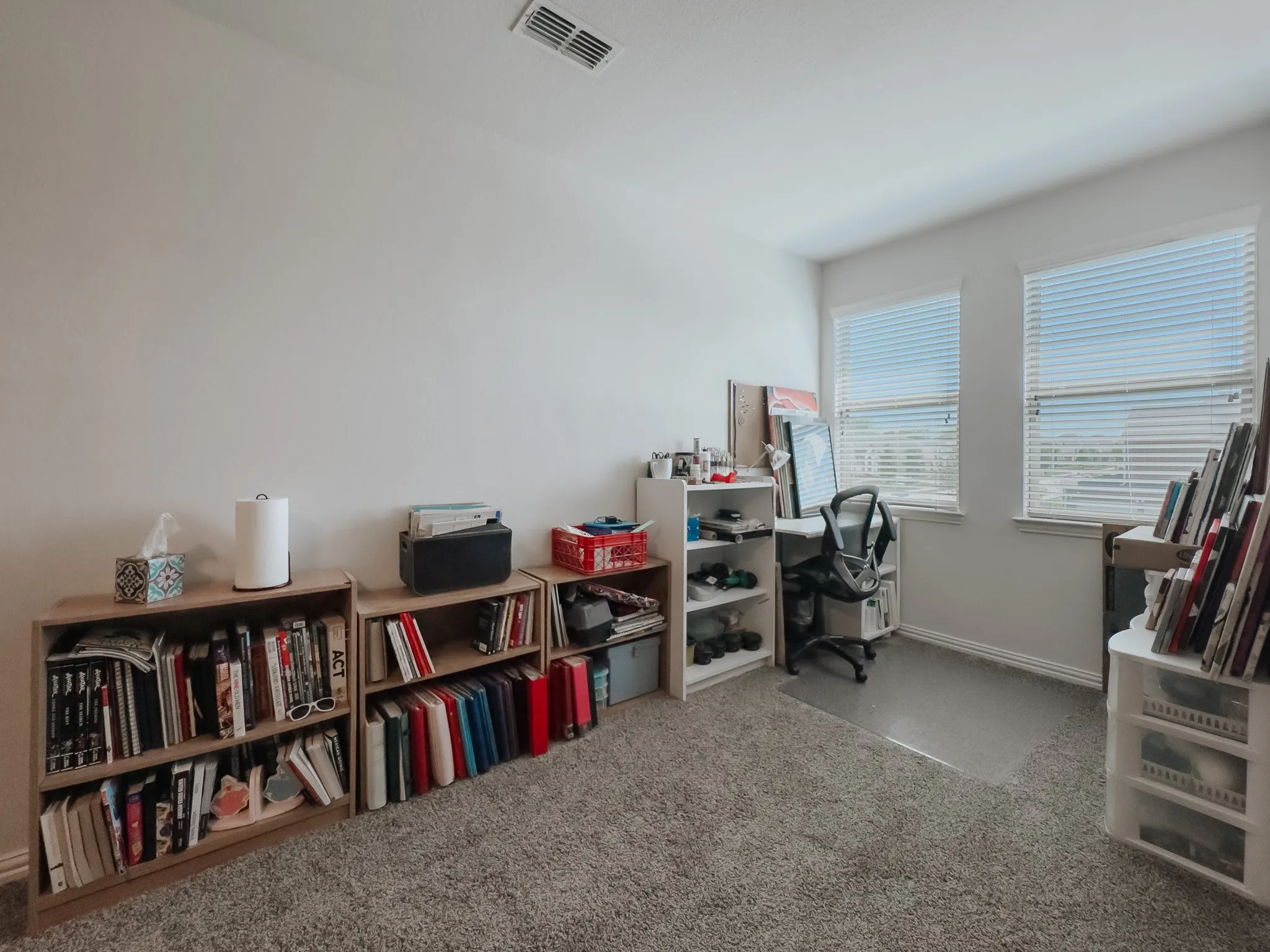 View of carpeted office in loft area & plenty of natural light