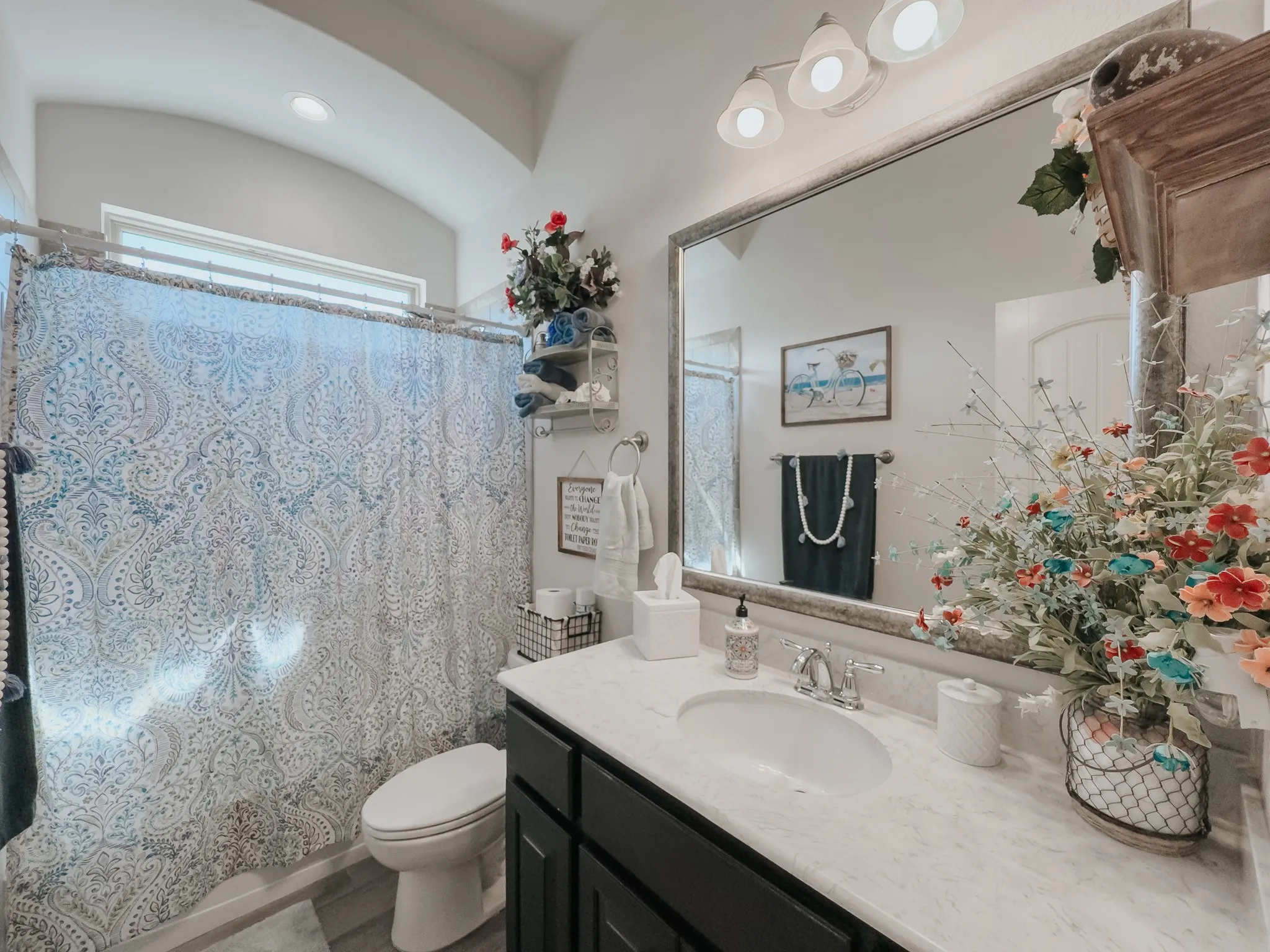Bathroom featuring large vanity and toilet