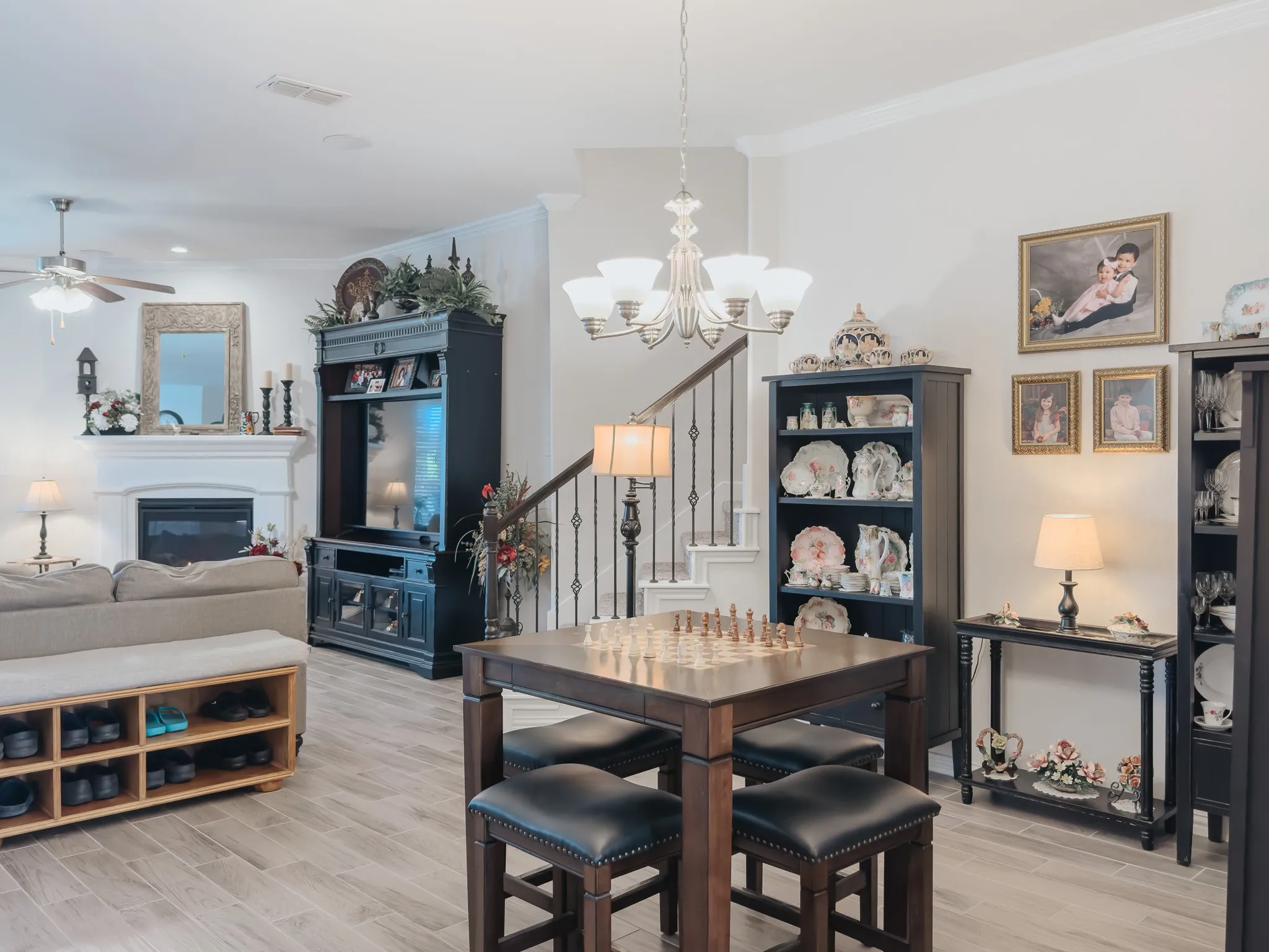 Dining area featuring, ceiling fan with notable chandelier, and ornamental molding
