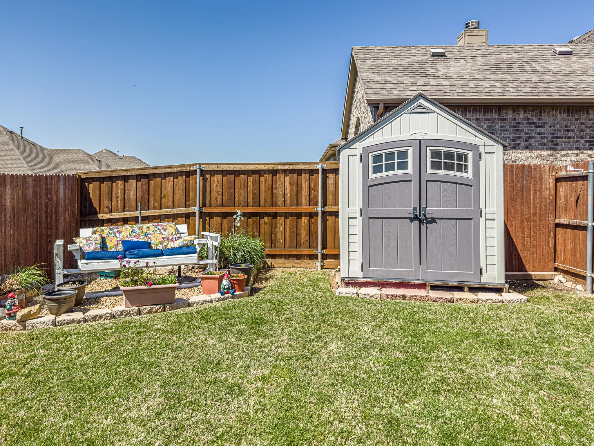 View of outdoor shed with a yard -- shed remains with sale of home -