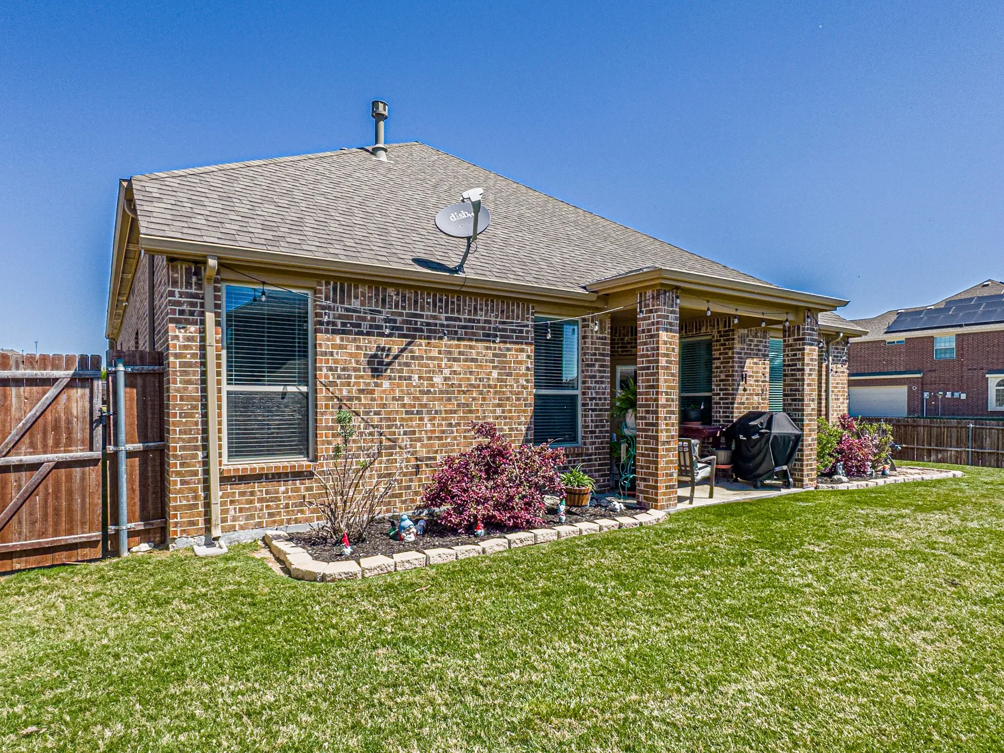 Rear view of property and yard