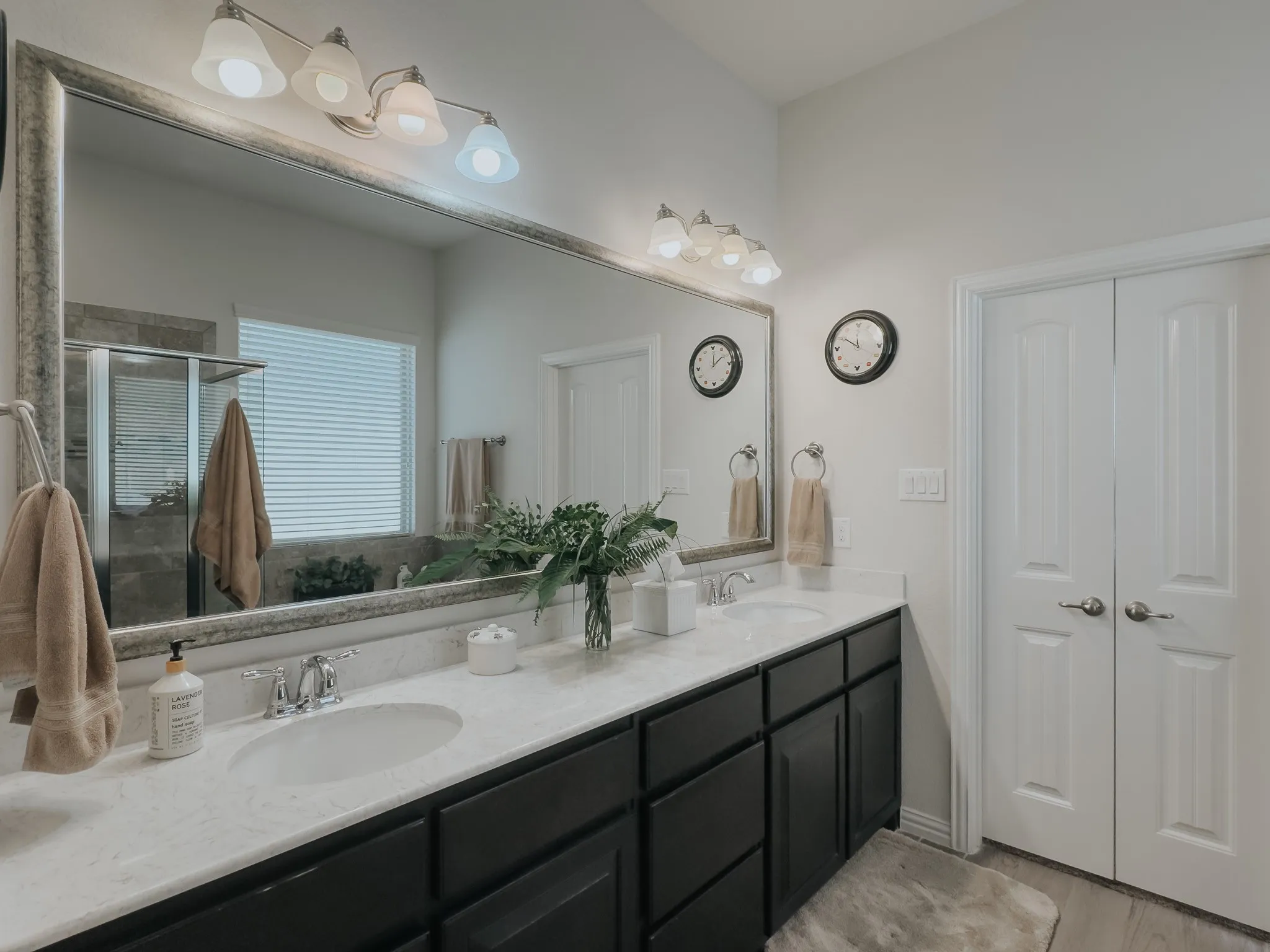 Bathroom with dual vanity.. great lighting