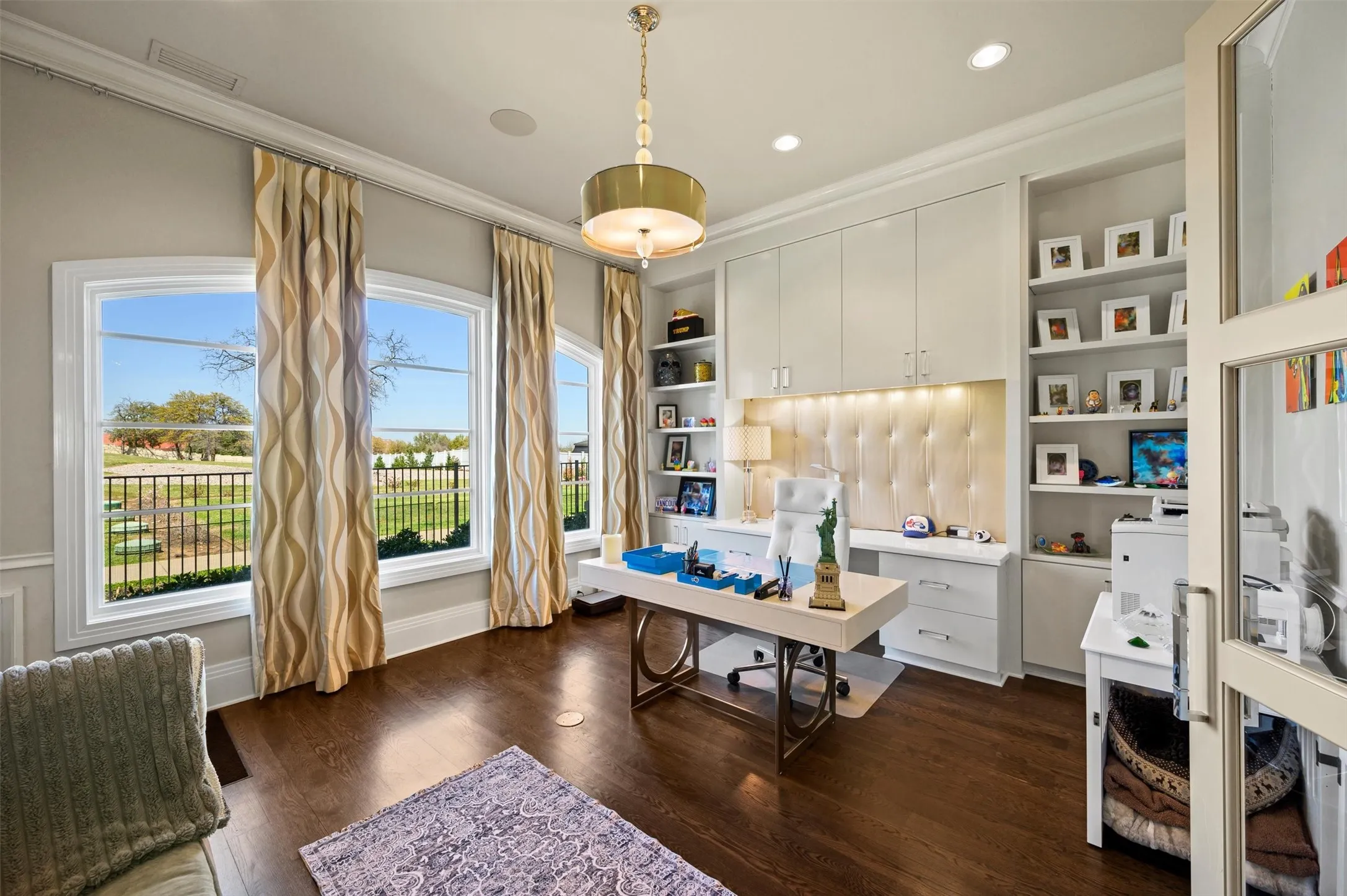 Her Executive Office with built-in desk, shelves and cabinets, overlooking the rolling backyard