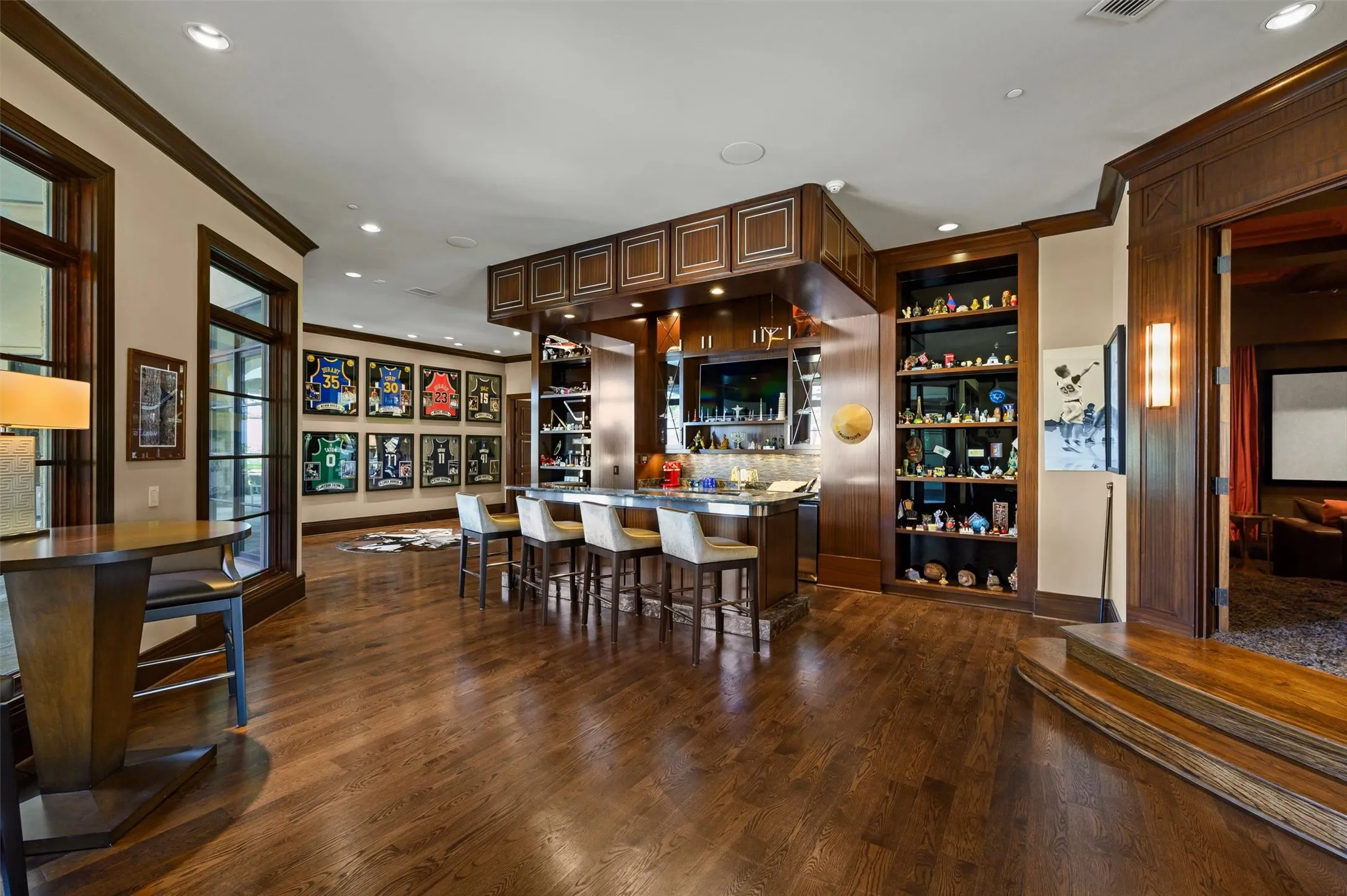Game Room with wet bar with fridge and ice maching, perfect for entertaining and watching sports