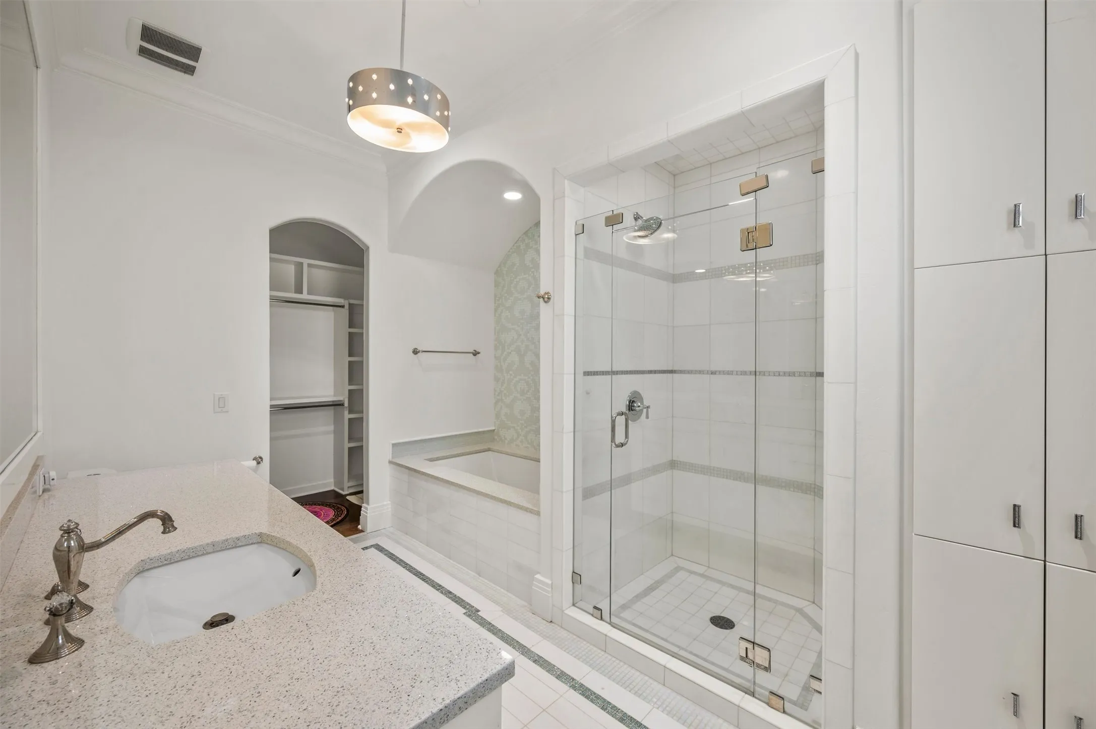 One of the Ensuite Bathrooms with a Walk-In Closet