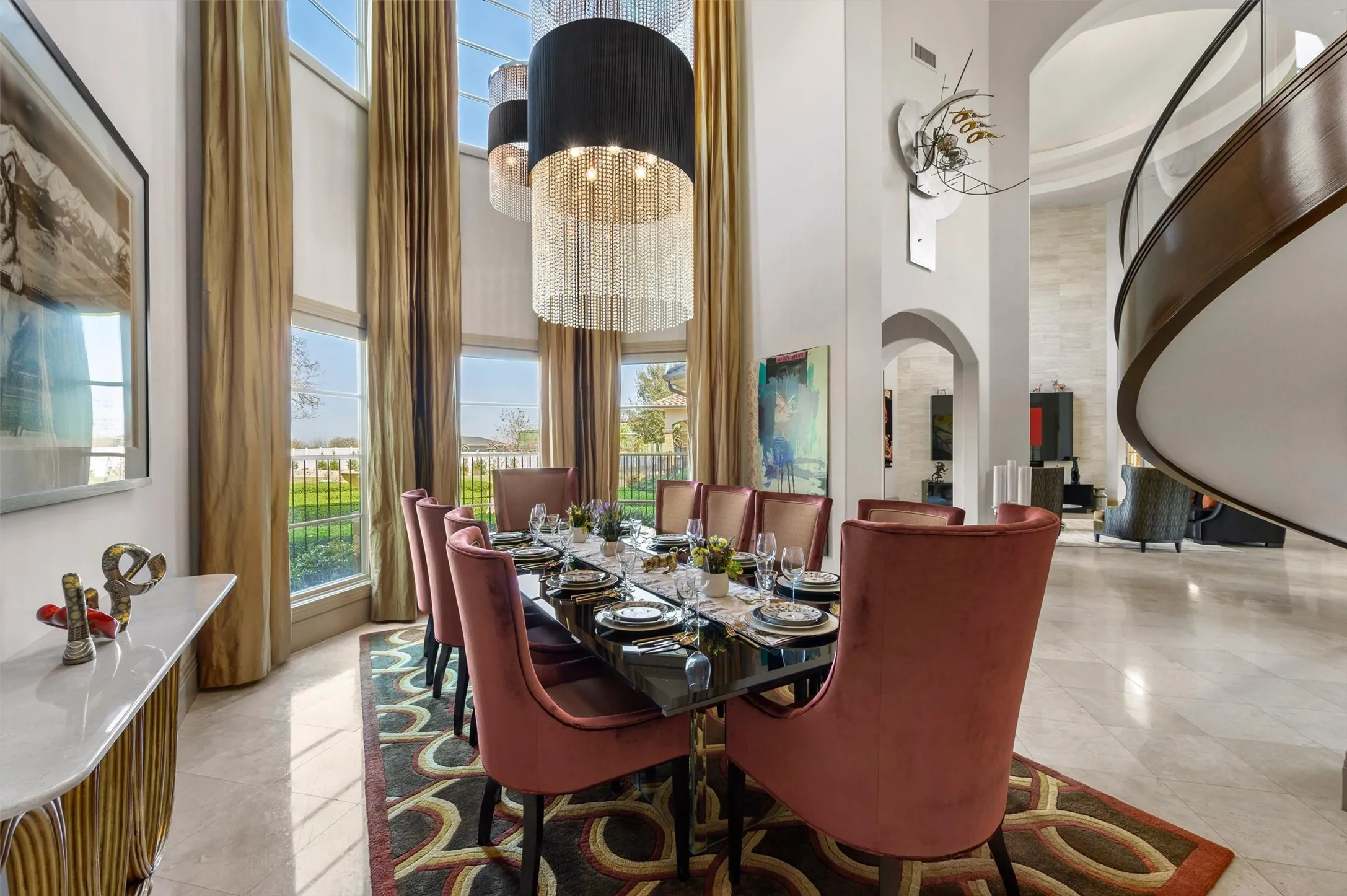 Formal Dining area featuring a high ceiling, suspended lighting, and arched walkways, overlooking Court Yard