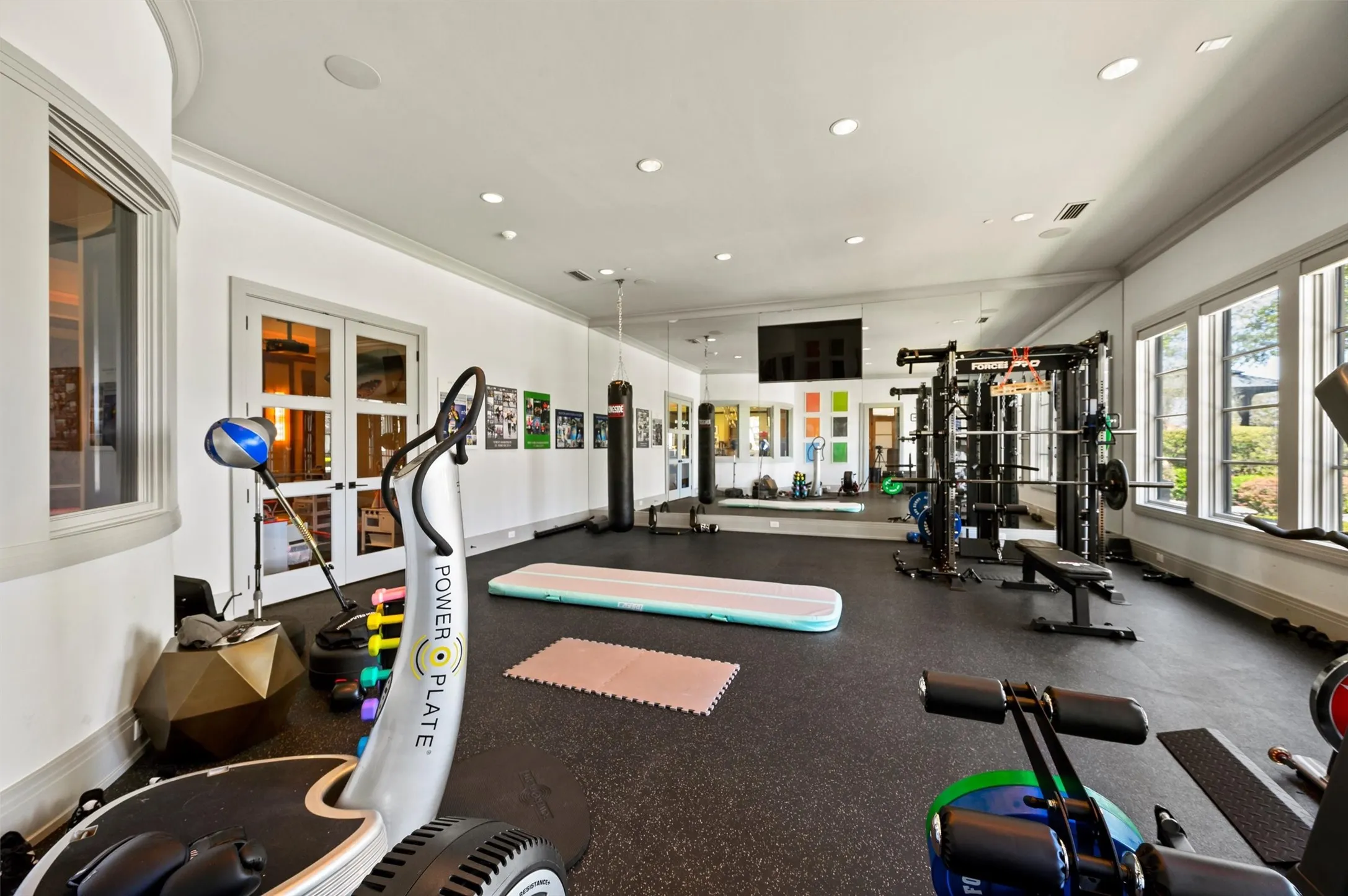 Workout area with recessed lighting, overlooking the resort style pool