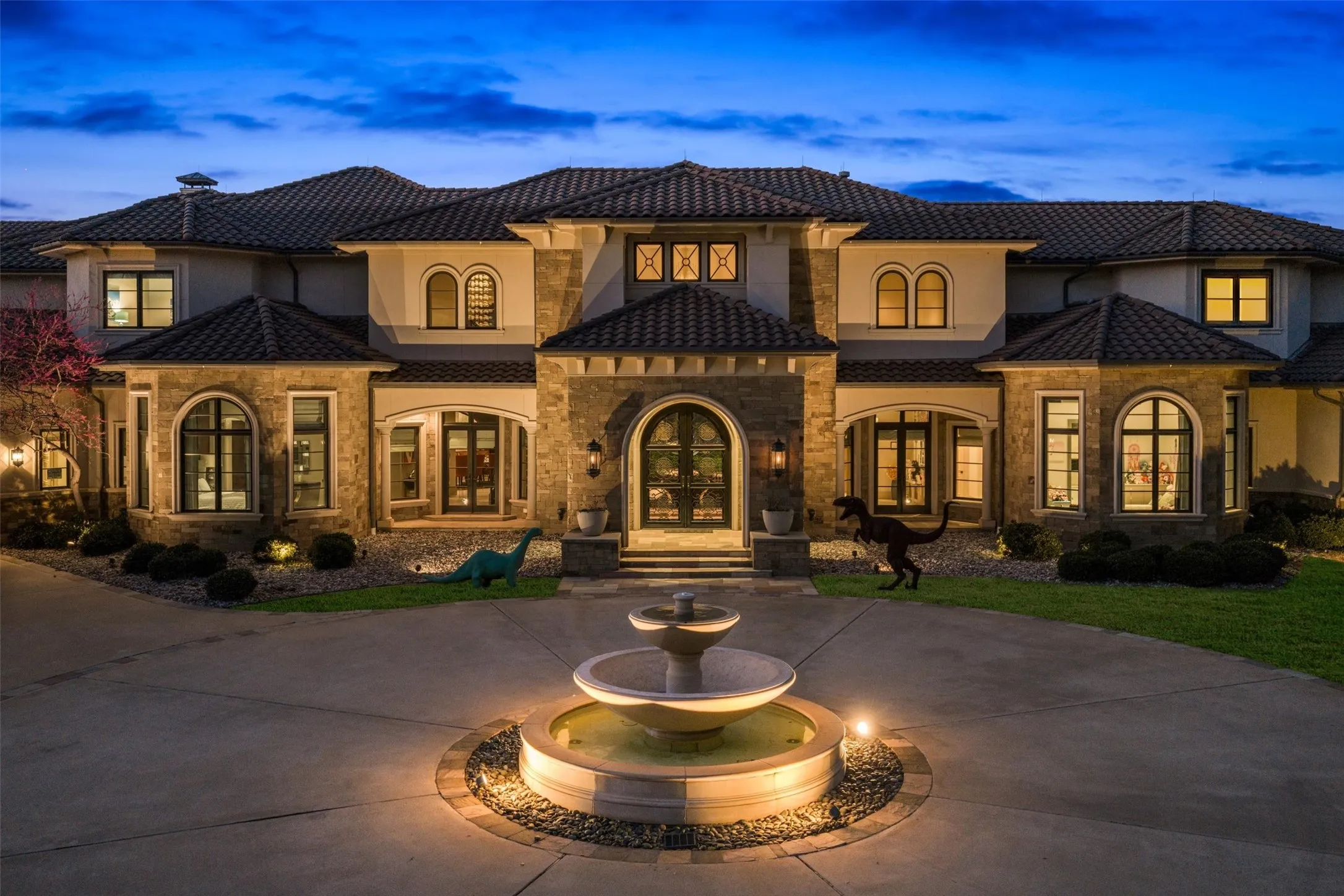Mediterranean-Style home featuring a circle drive, and fountain feature