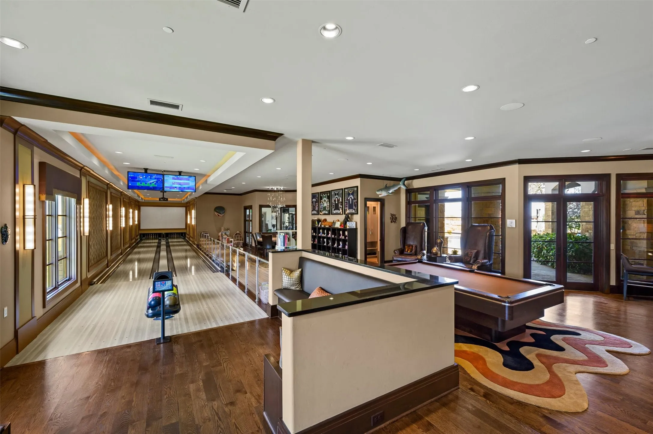 The game room includes and area large enough for a Billard Table, & has a 2 lane bowling alley
