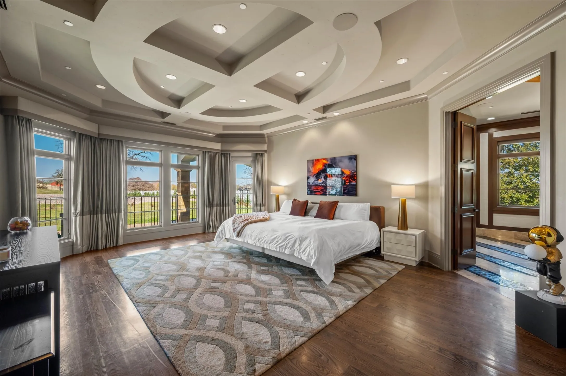 Primary Bedroom featuring hardwood / wood-style flooring, coffered ceiling, access to exterior, and recessed lighting with Primary Ensuite