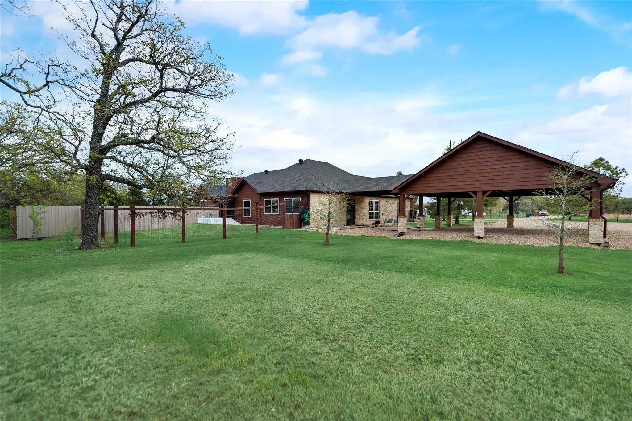 Covered barn with adjoining storage.