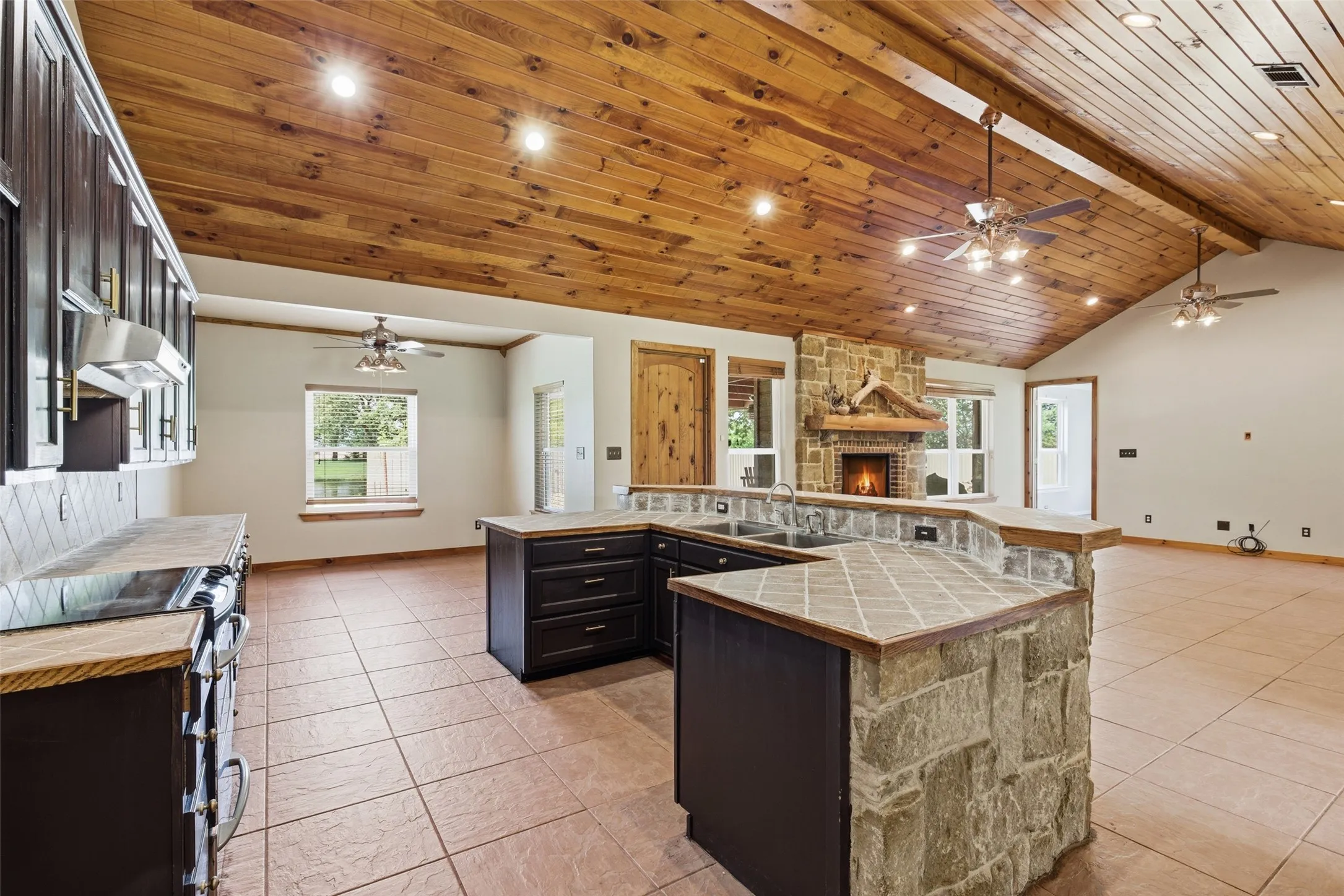Lighly staged, breakfast area with views of the back pasture & pool.