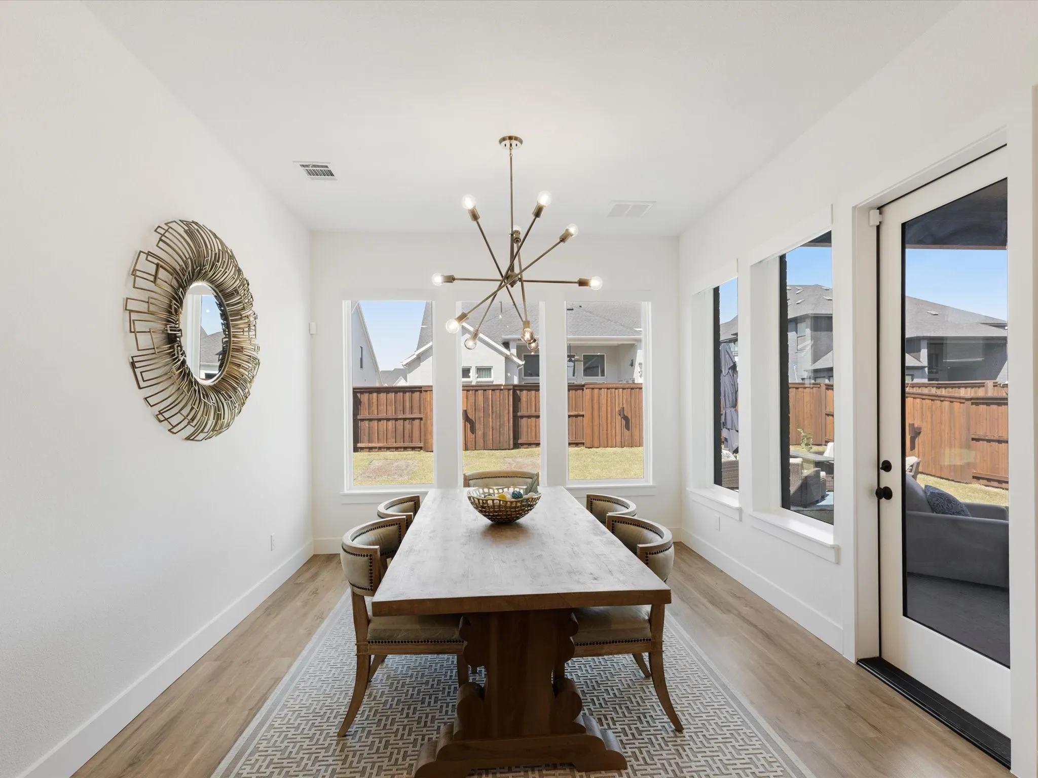 Dining area featuring a chandelier and light wood-style flooring