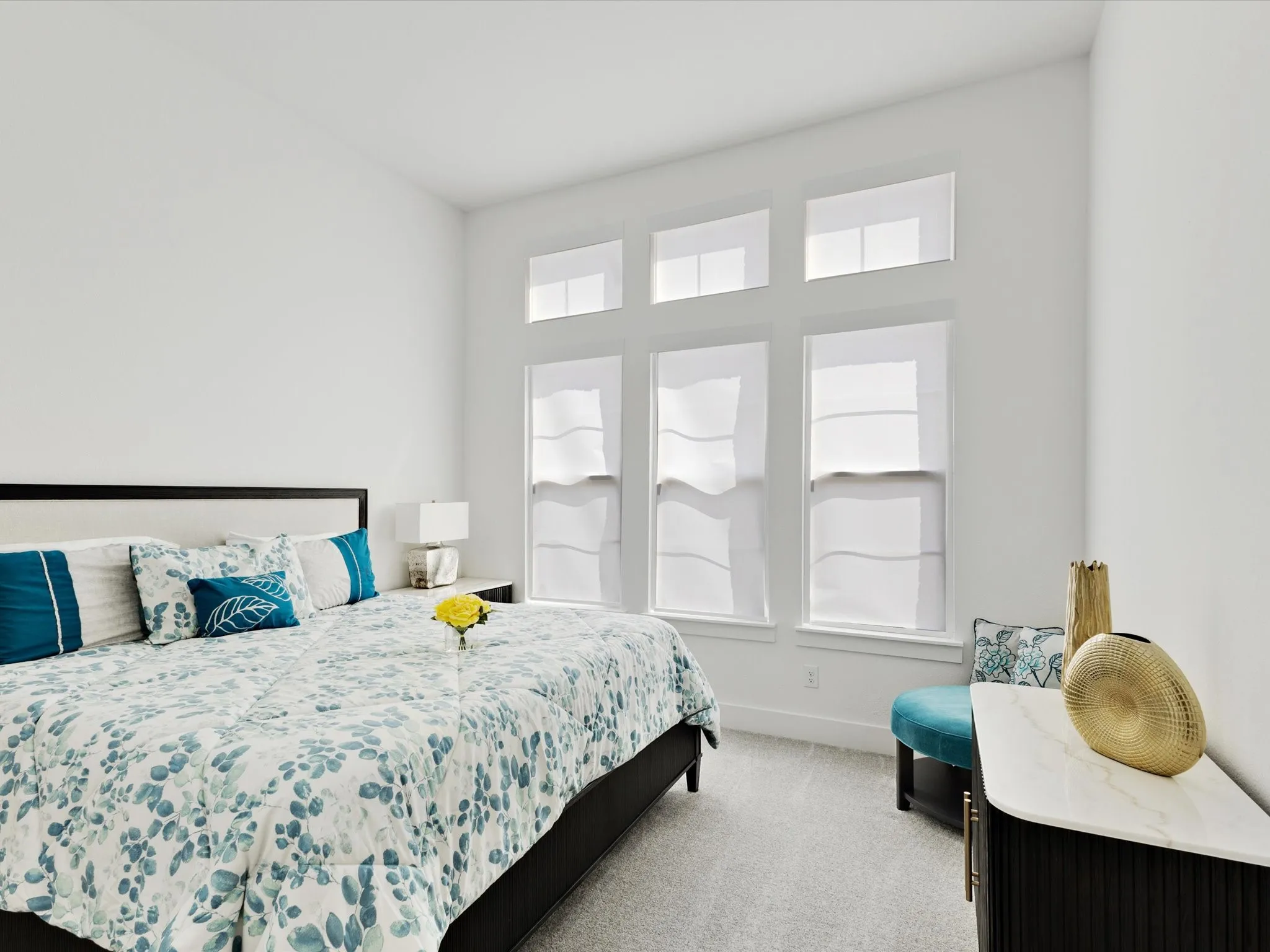 MIL suite with light carpet and baseboards
