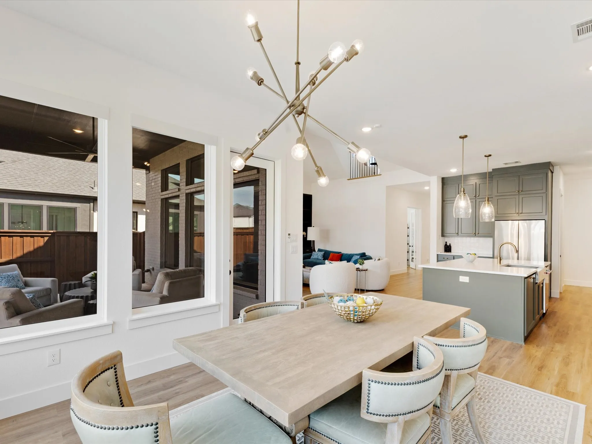 Dining space with light wood-style floors and baseboards
