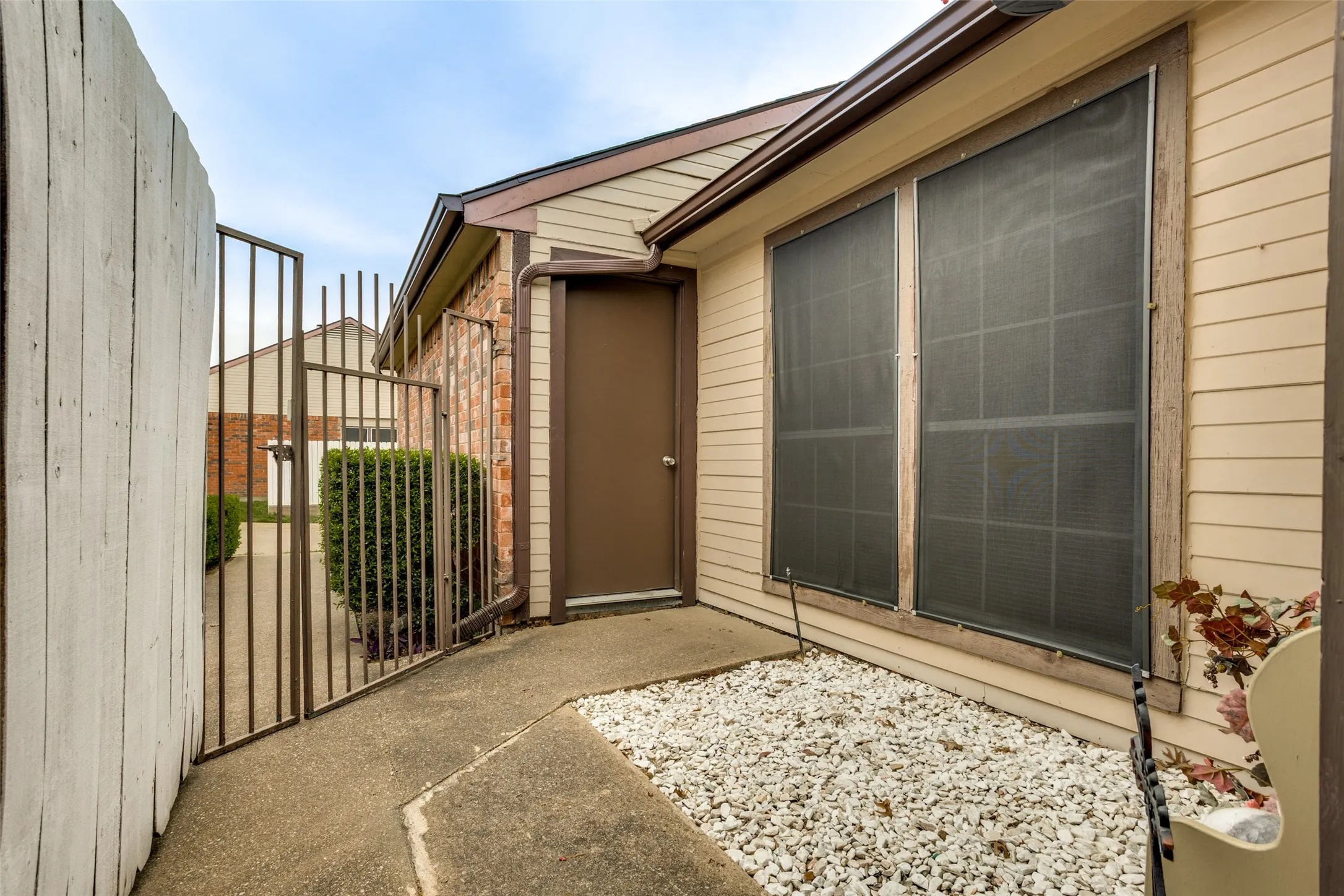 Gated front area door leading to the garage.
