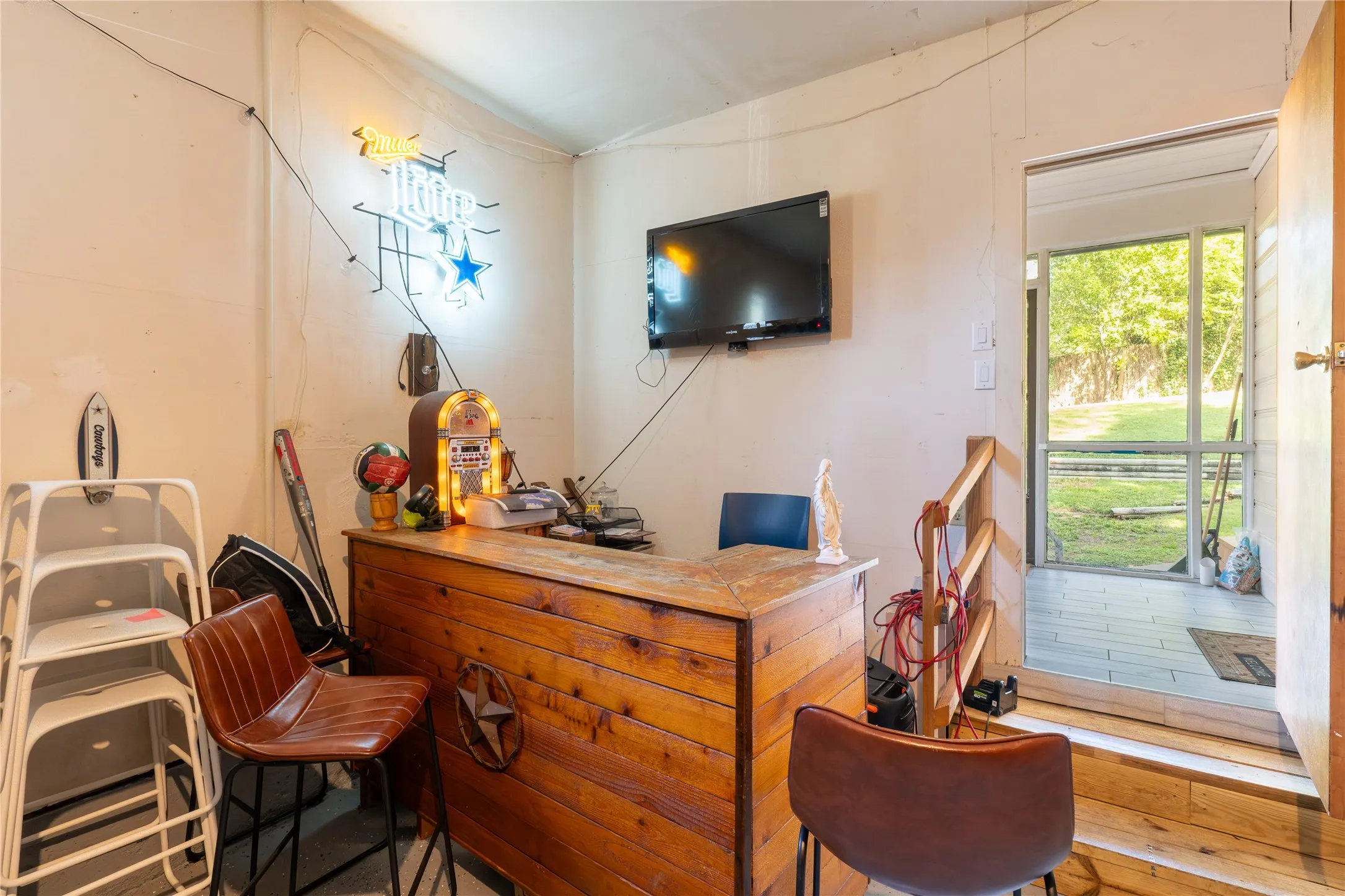 Home office featuring vaulted ceiling