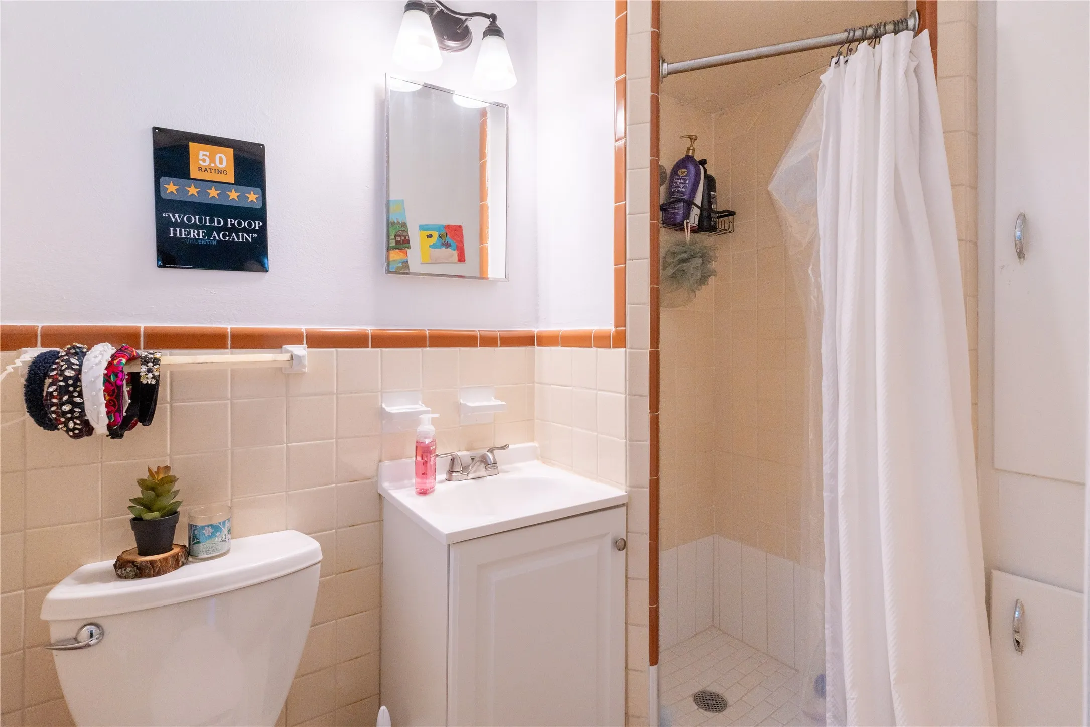 Bathroom featuring vanity and a shower stall