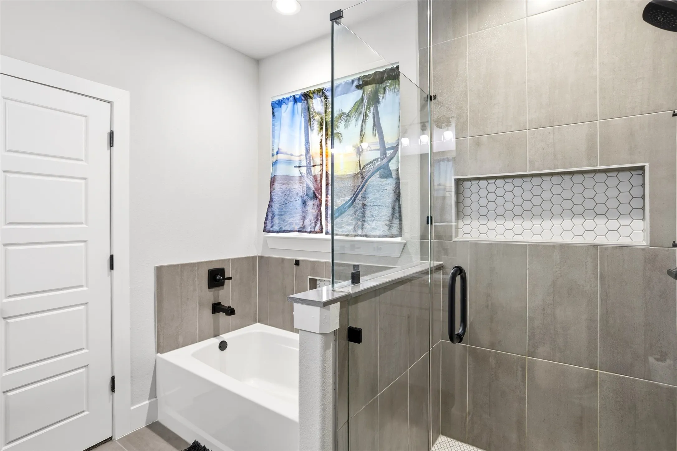 Full bathroom with a stall shower, a garden tub, and recessed lighting
