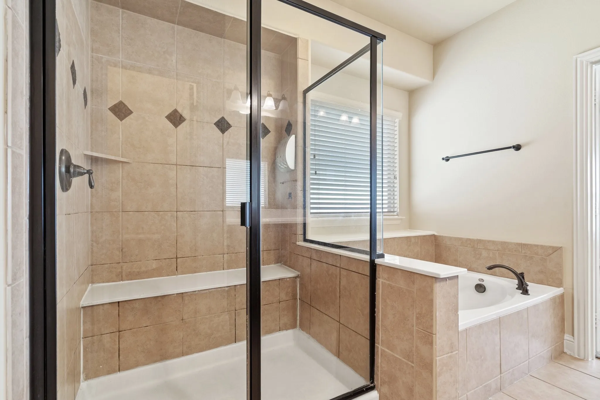 En-suite Primary bath with walk-in Rain shower and separate garden tub to relax after work