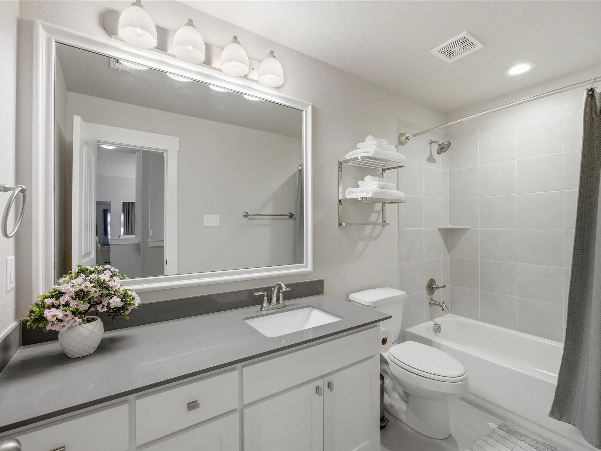 Full bath with vanity, shower / tub combo, and recessed lighting