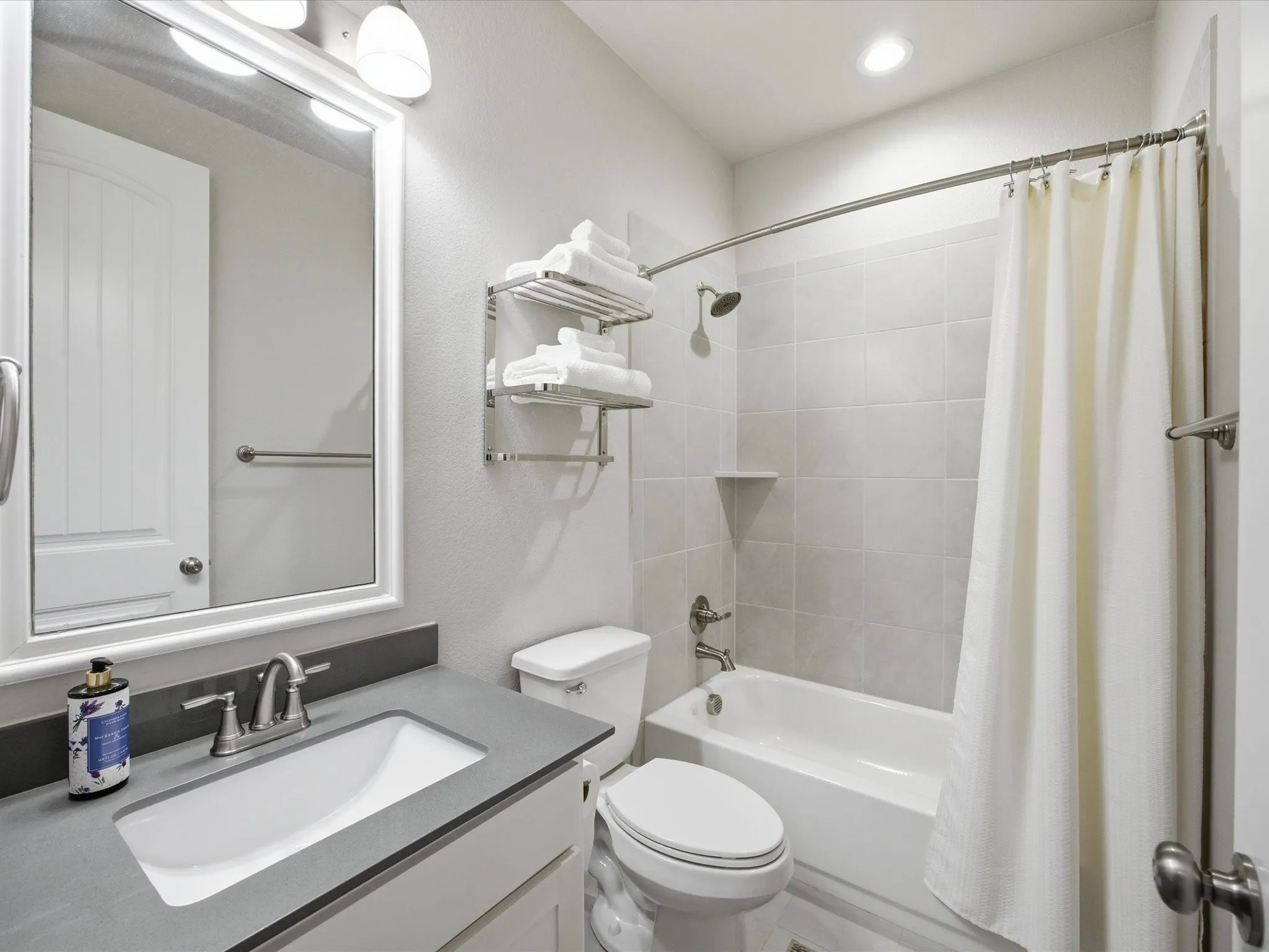 Full bathroom featuring vanity and shower / bath combo