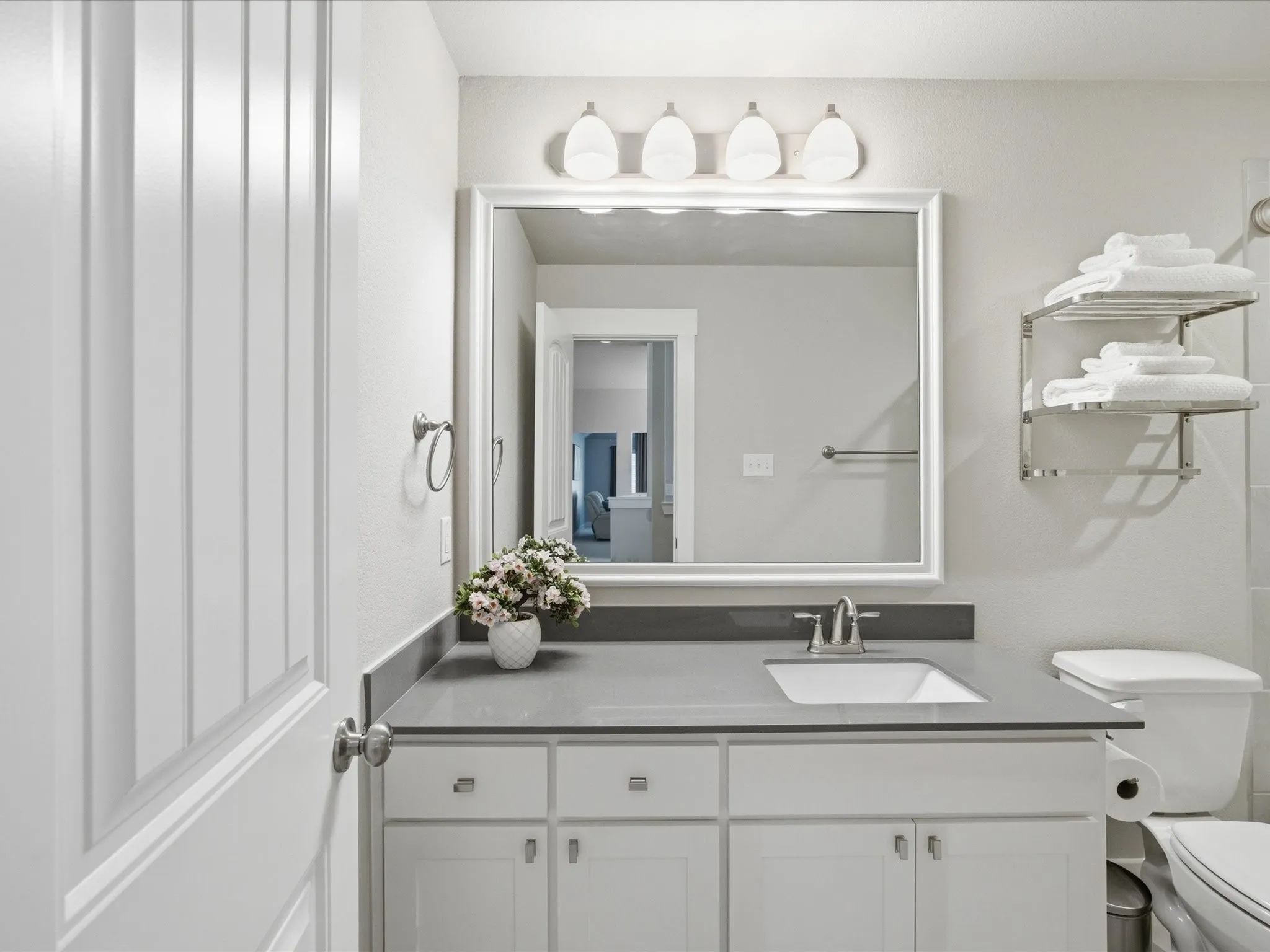 Upstairs full bath featuring vanity and toilet