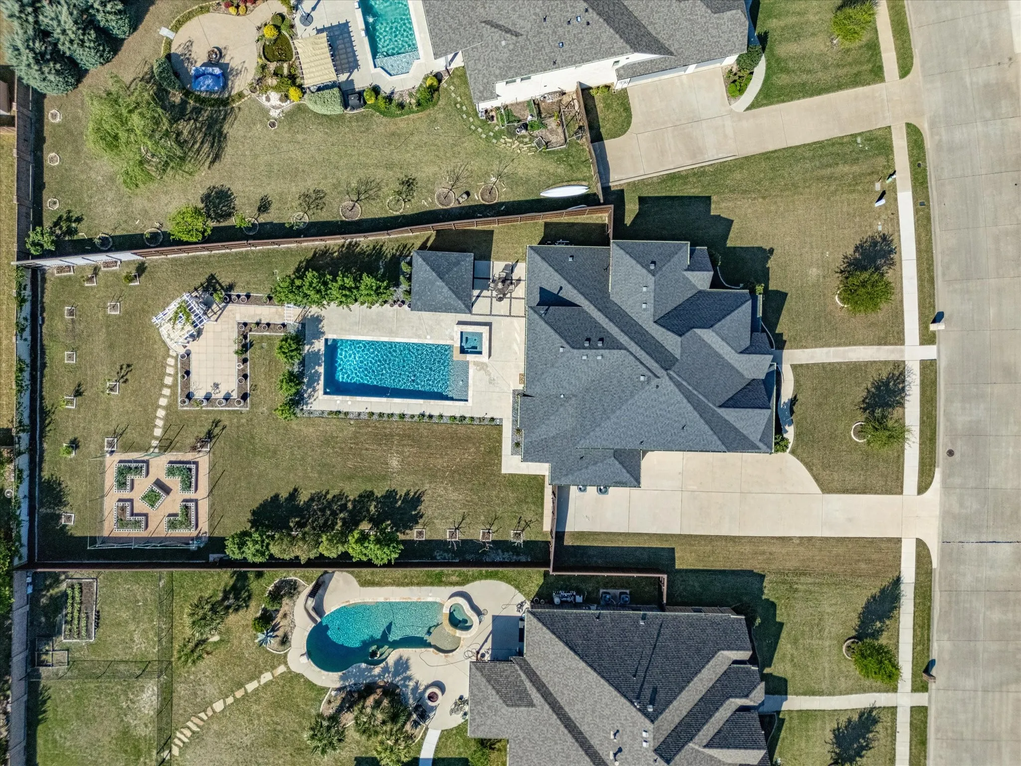 Aerial view of property's location featuring a pool