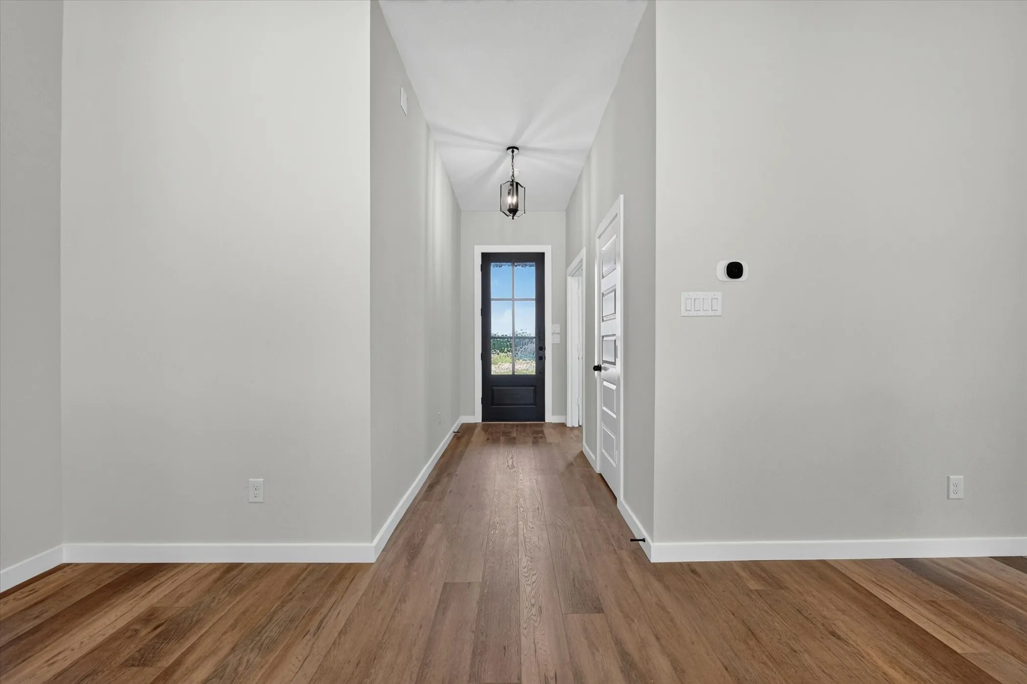 Wood-finish flooring throughout the entryway