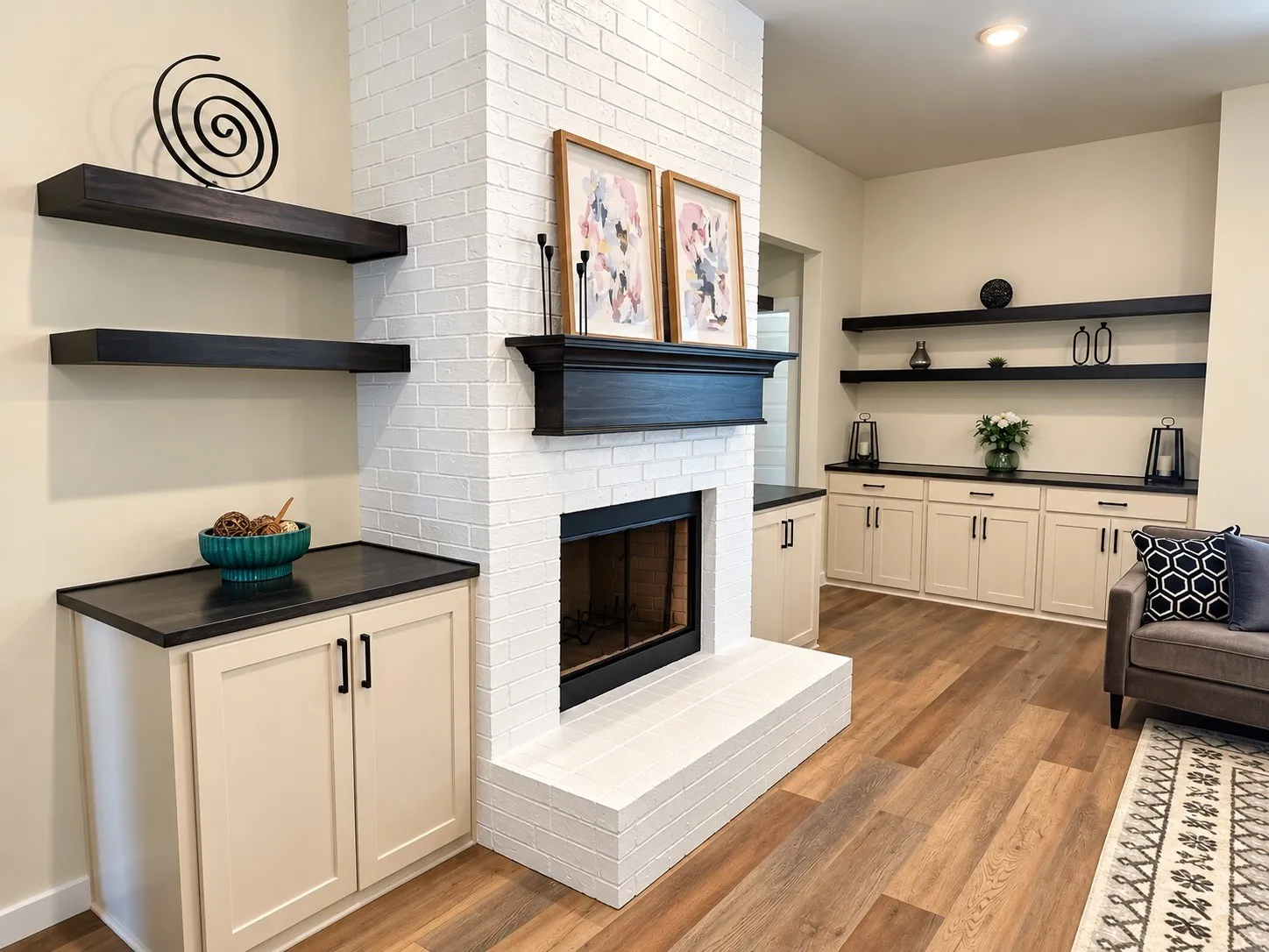 White brick fireplace with dark wood-finish mantel and hearth