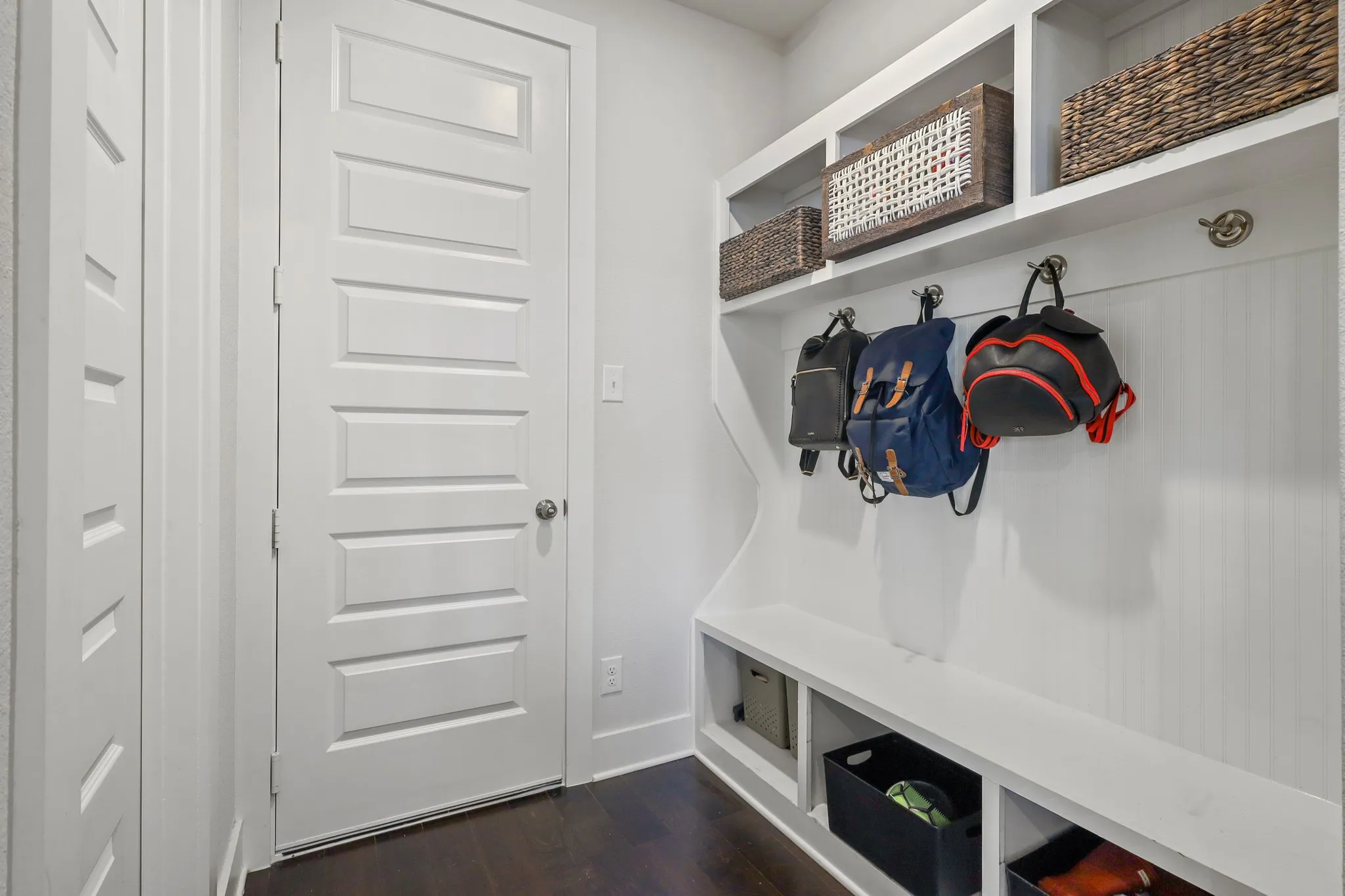 Mudroom with dark hardwood / wood-style floors