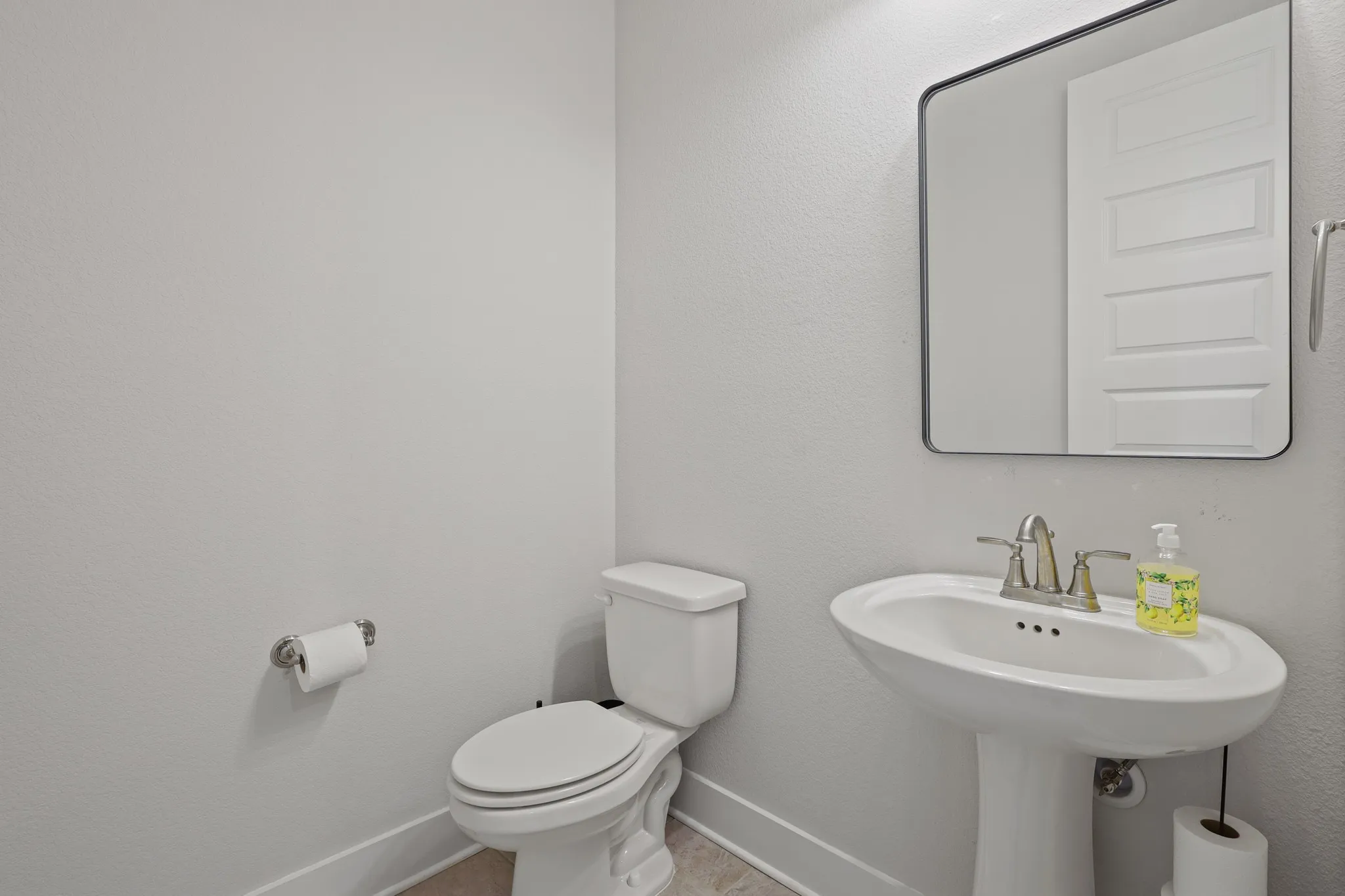 Bathroom featuring tile patterned floors and toilet