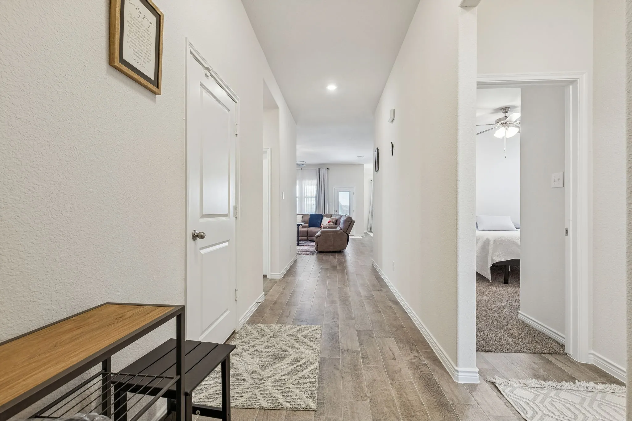 Hall with recessed lighting and light wood-style flooring