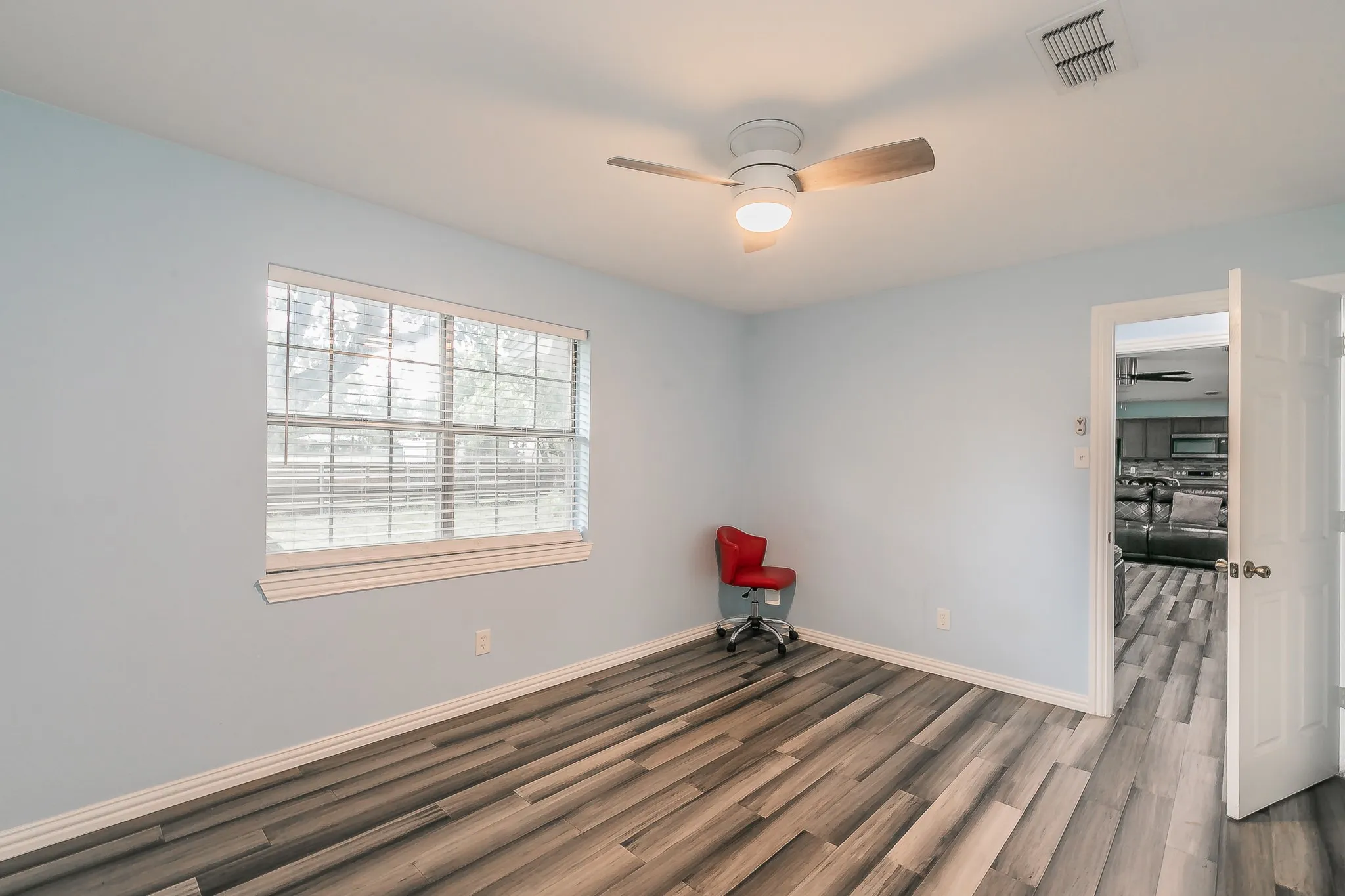 Spare room featuring a ceiling fan and wood finished floors