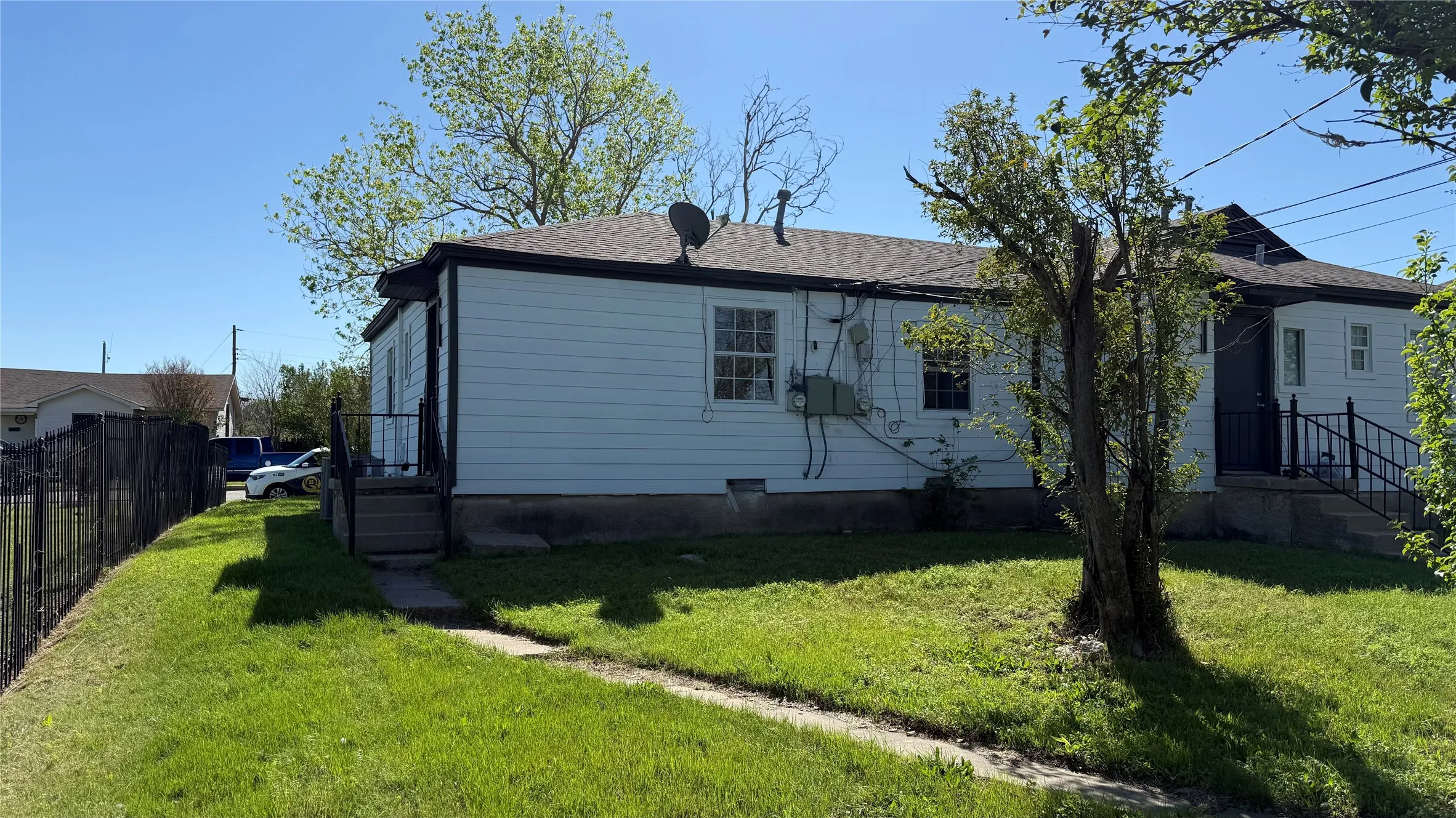 Back of property with roof with shingles