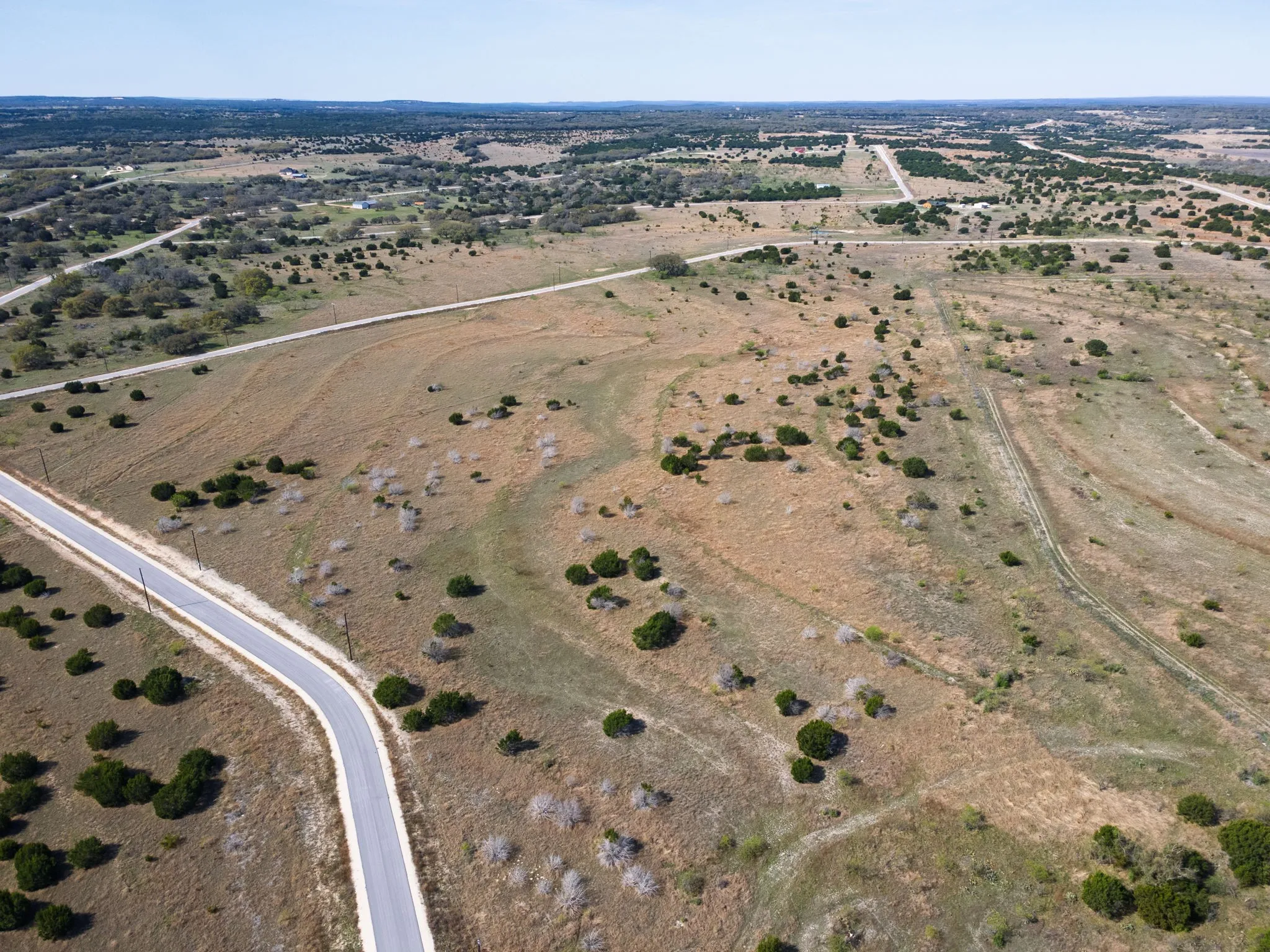 Aerial view of property and surrounding area featuring rural landscape