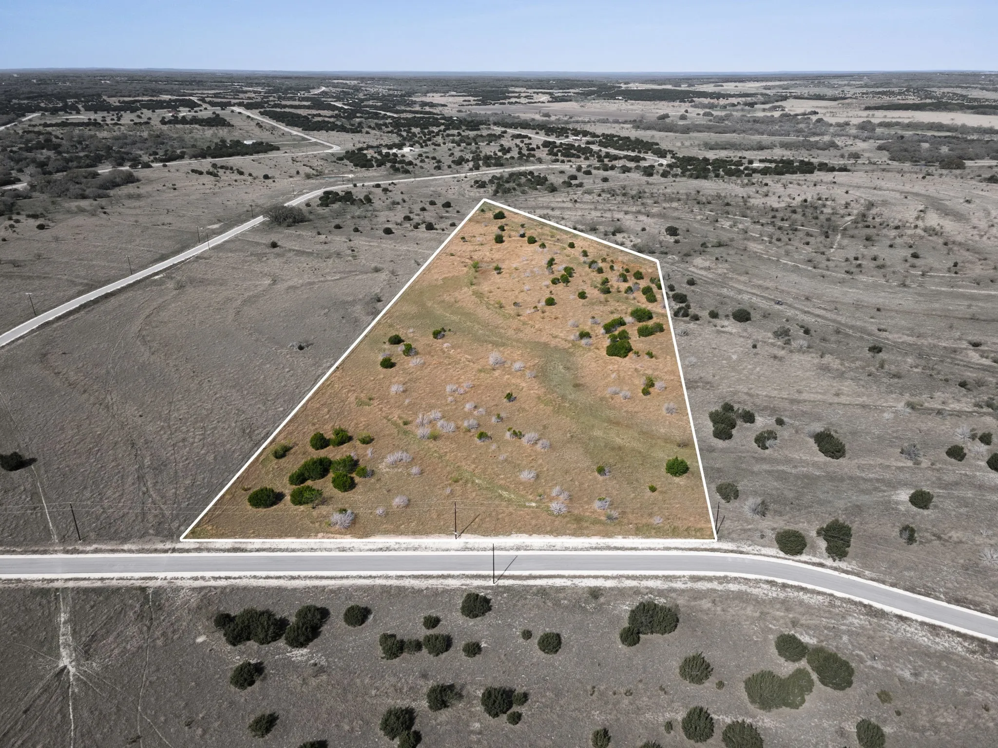Aerial view of property's location featuring property parcel outlined and rural landscape