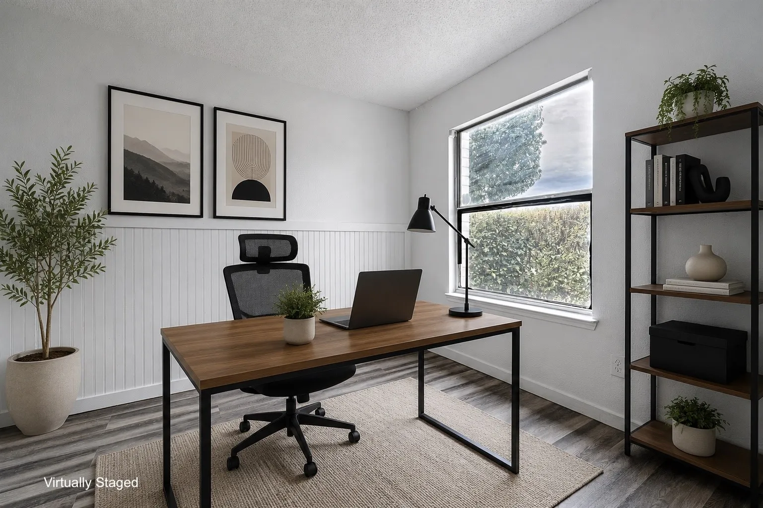 Light-filled interior space featuring white walls with wainscoting, wood-finish flooring, and a large window