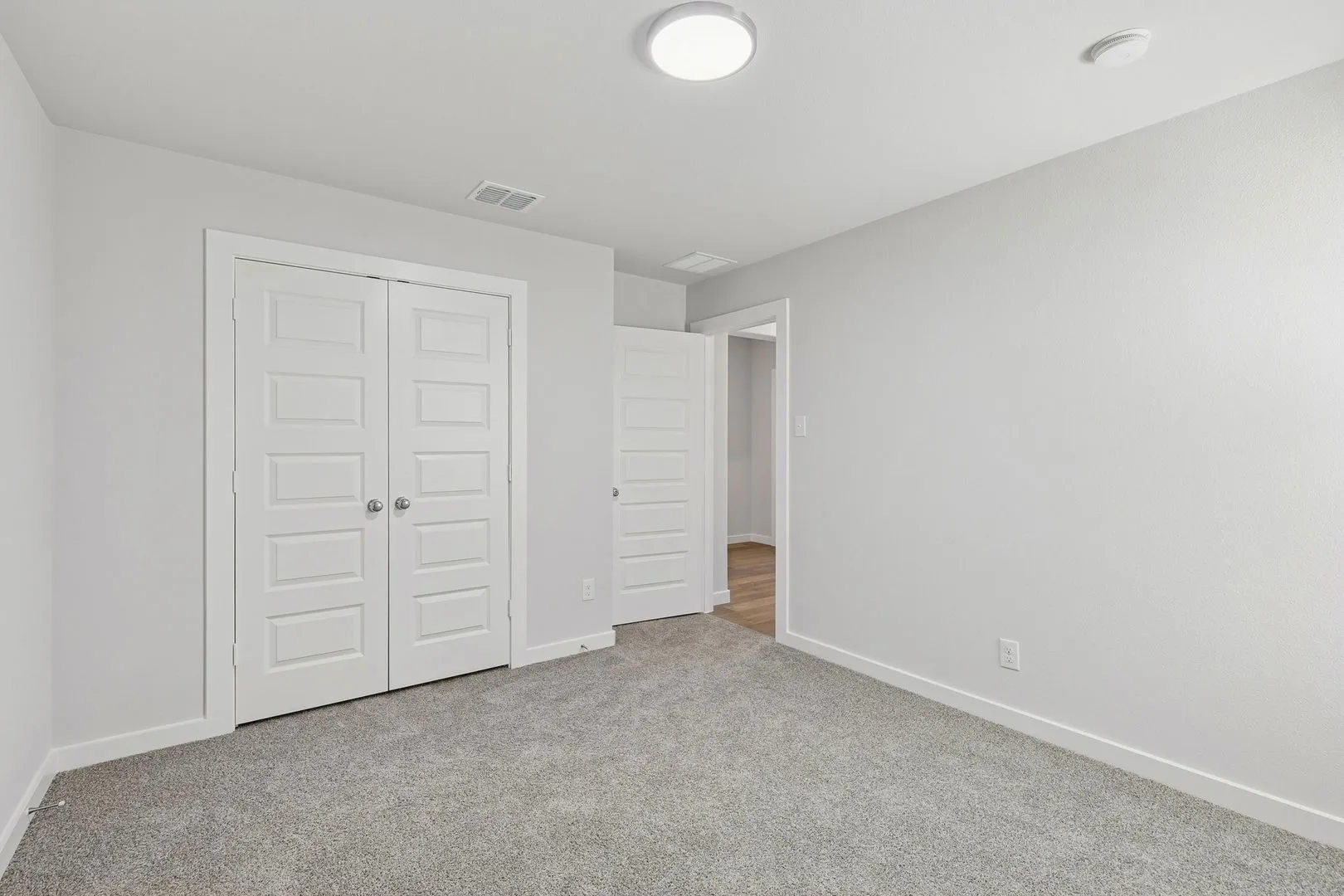 Bedroom in the Harrison home plan by Trophy Signature Homes – REPRESENTATIVE PHOTO