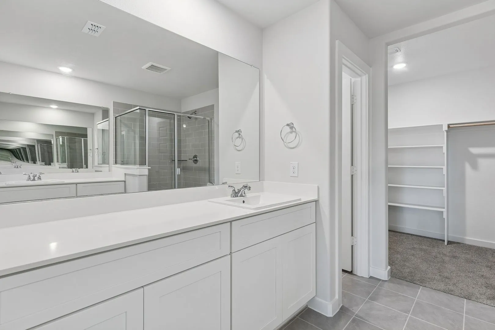 Primary Bathroom in the Harrison home plan by Trophy Signature Homes – REPRESENTATIVE PHOTO