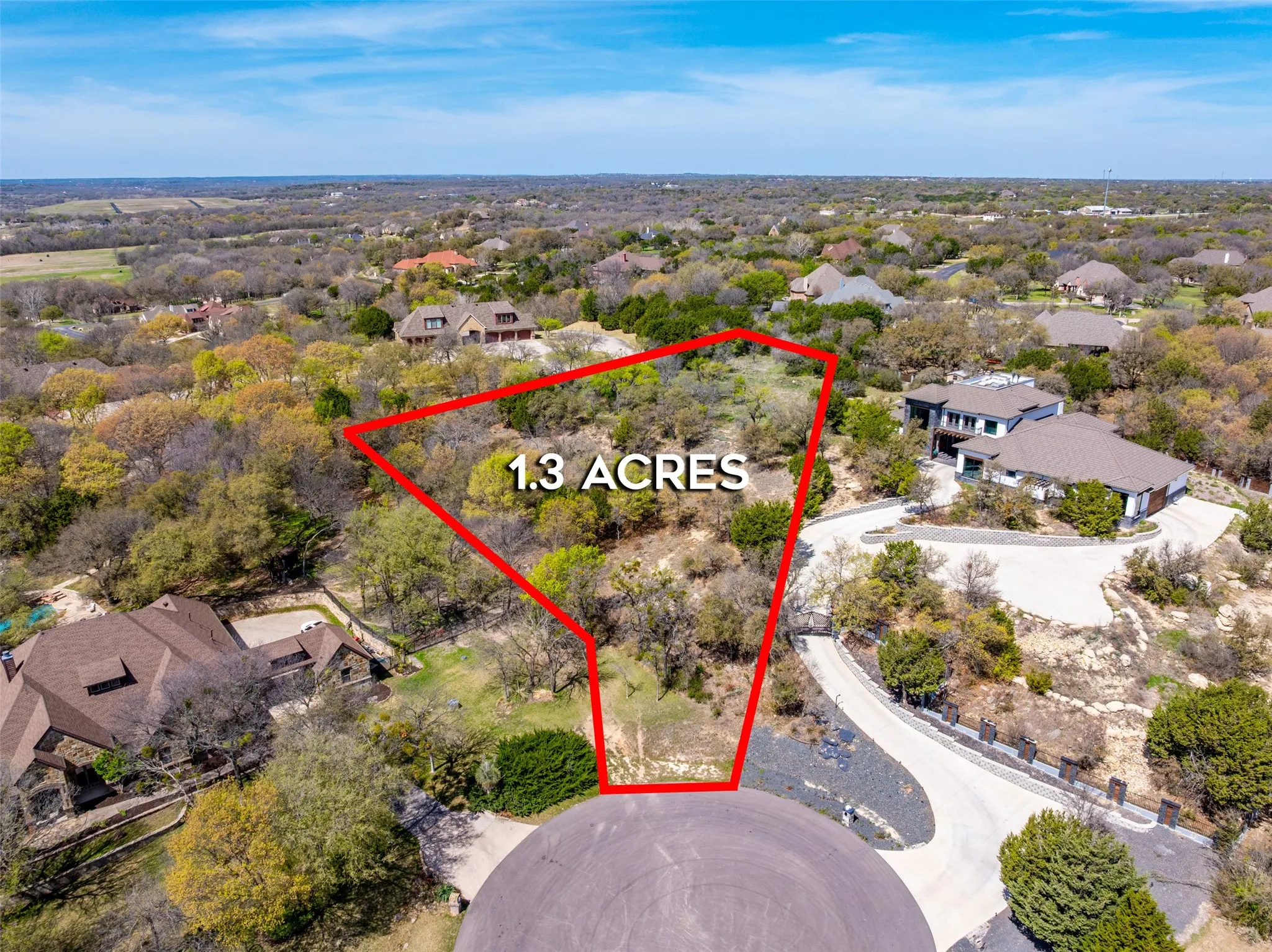 Aerial view of residential area with property parcel outlined