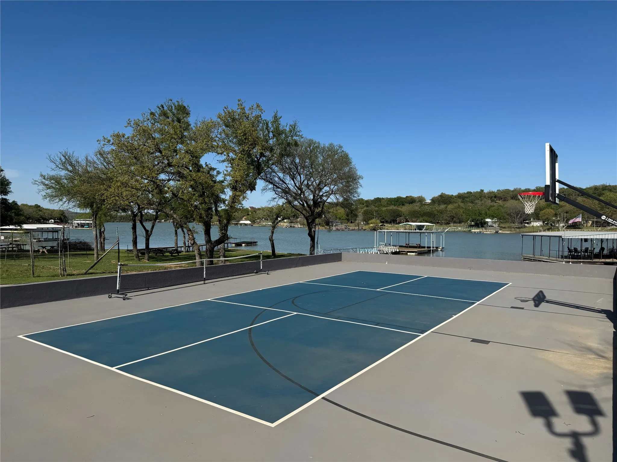 View of Sport court and a lake
