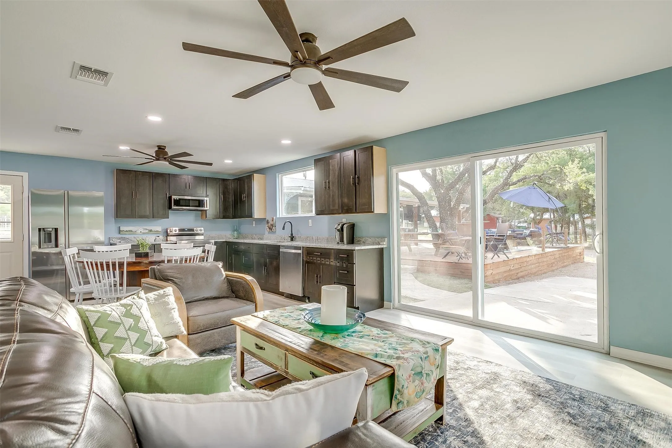 Guest Living room featuring plenty of natural light, ceiling fan, and recessed lighting