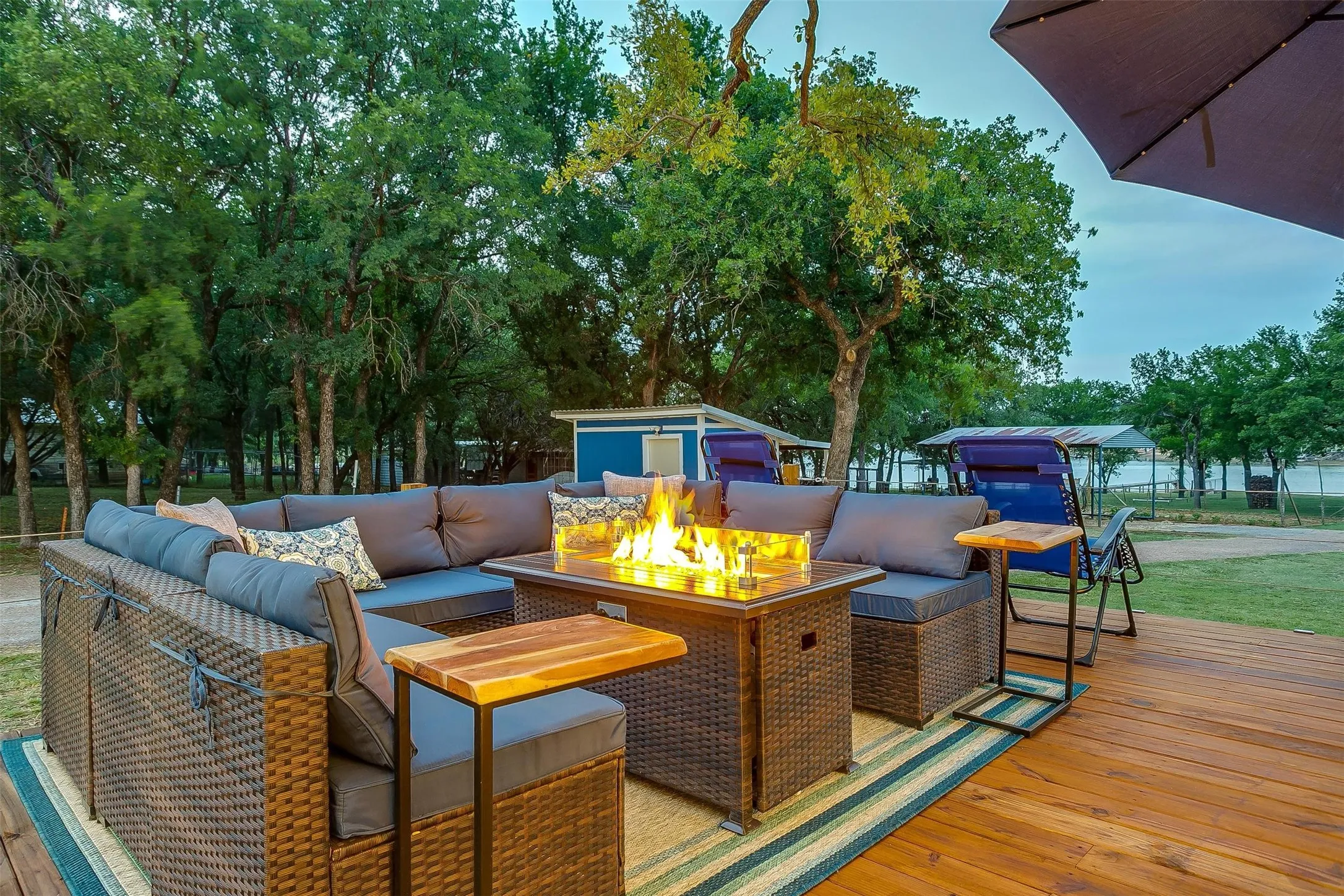 Wooden deck with an outdoor living space with a fire pit