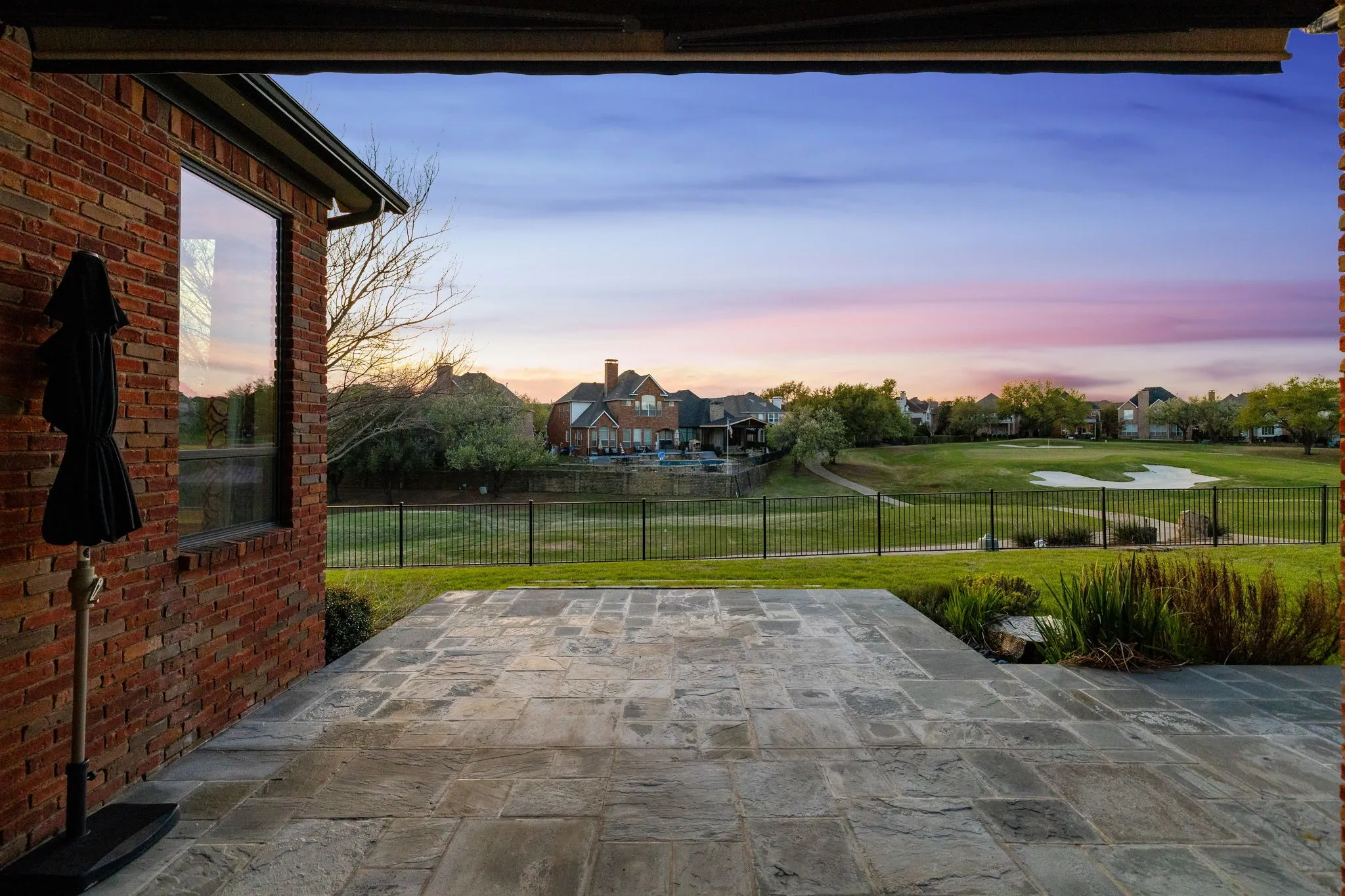 Patio terrace at dusk with a patio area