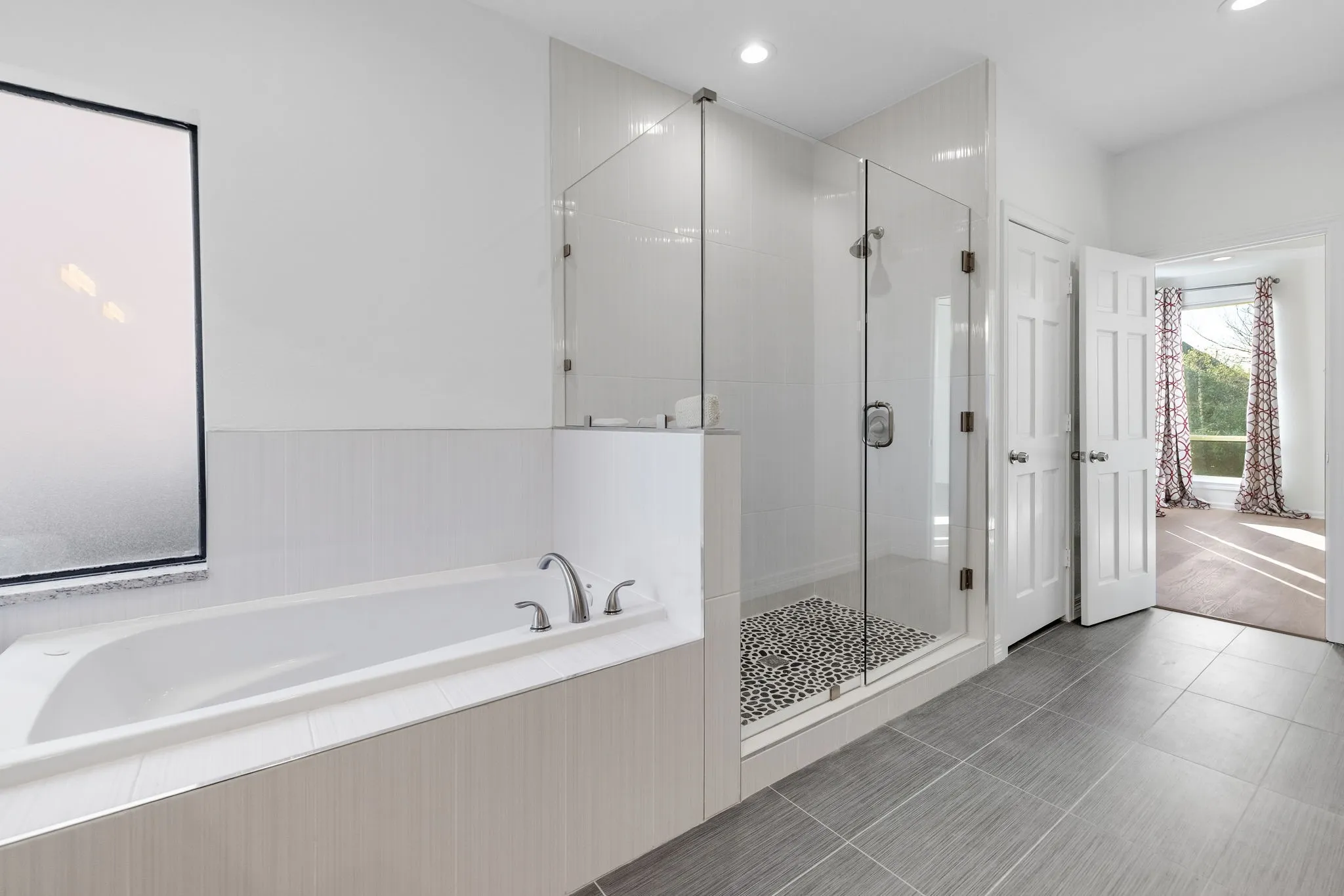 Bathroom with a shower stall, a bath, light tile patterned floors, and recessed lighting