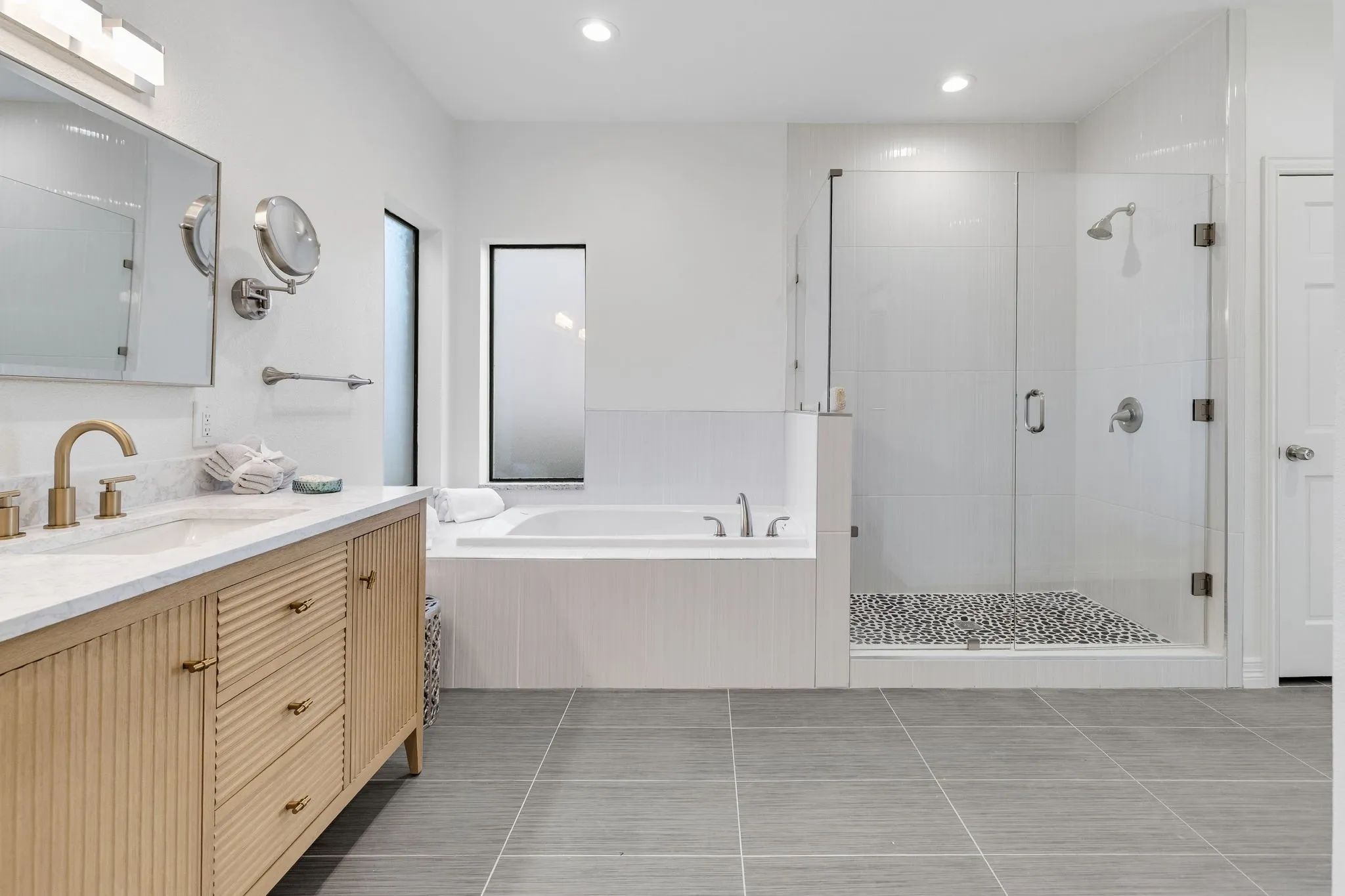 Bathroom with vanity, a stall shower, a bath, recessed lighting, and light tile patterned flooring