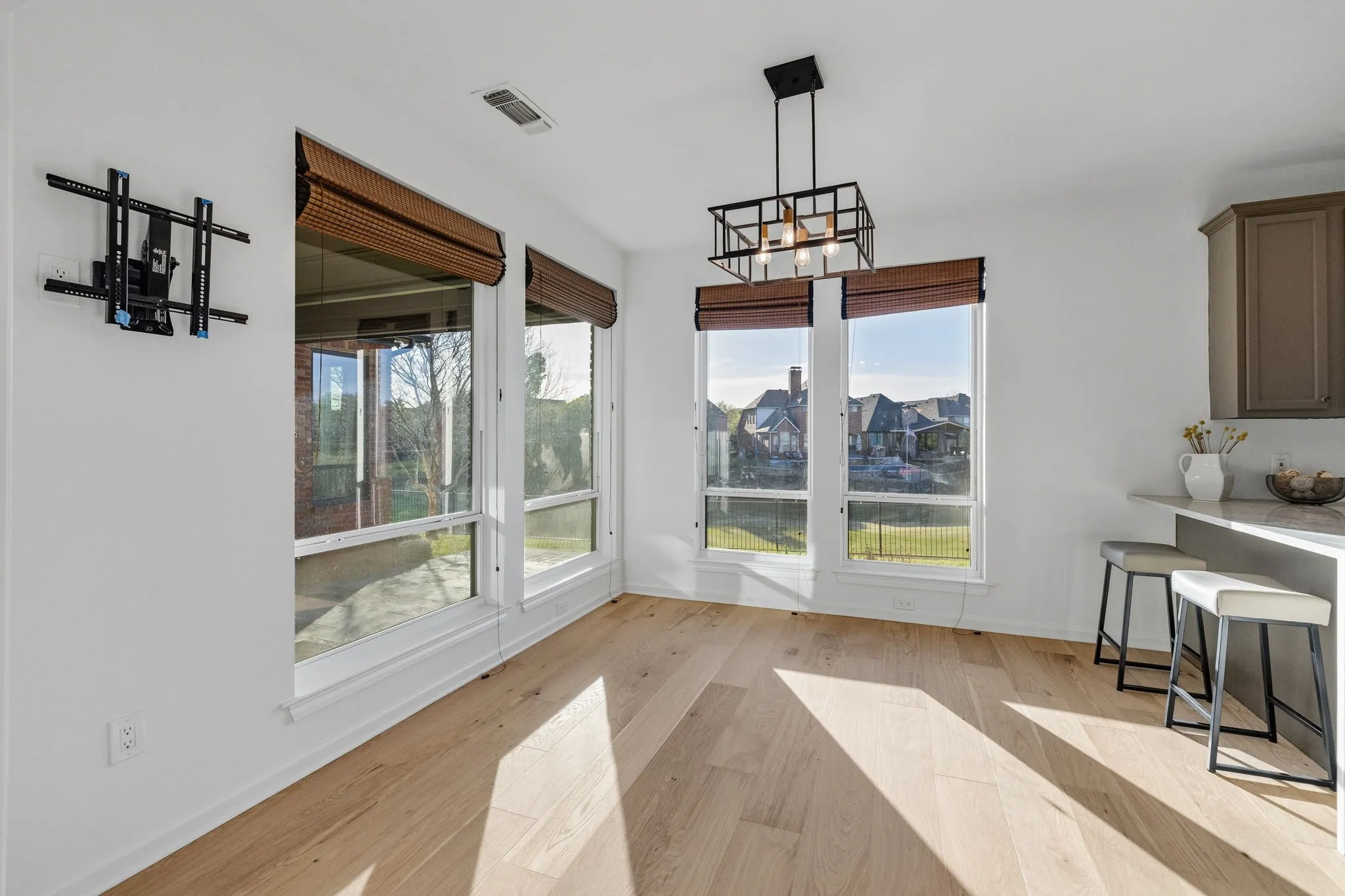 Unfurnished dining area with light wood-style flooring and a chandelier