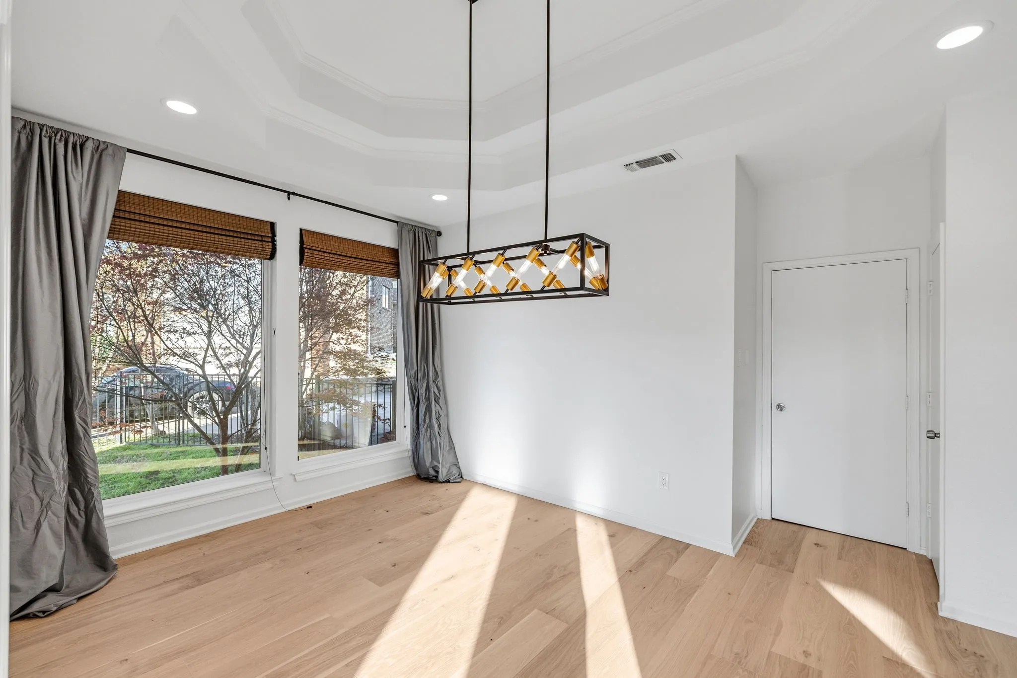 Unfurnished dining area featuring recessed lighting, light wood finished floors, and ornamental molding