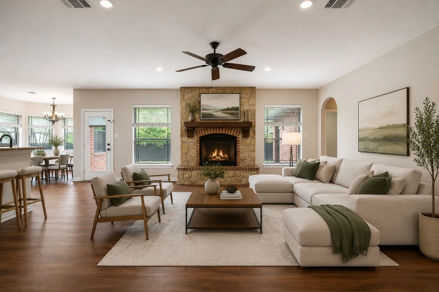 Virtually Staged Living area featuring a stone and brick fireplace with a wood mantel, wood-finish flooring, recessed lighting, and a ceiling fan